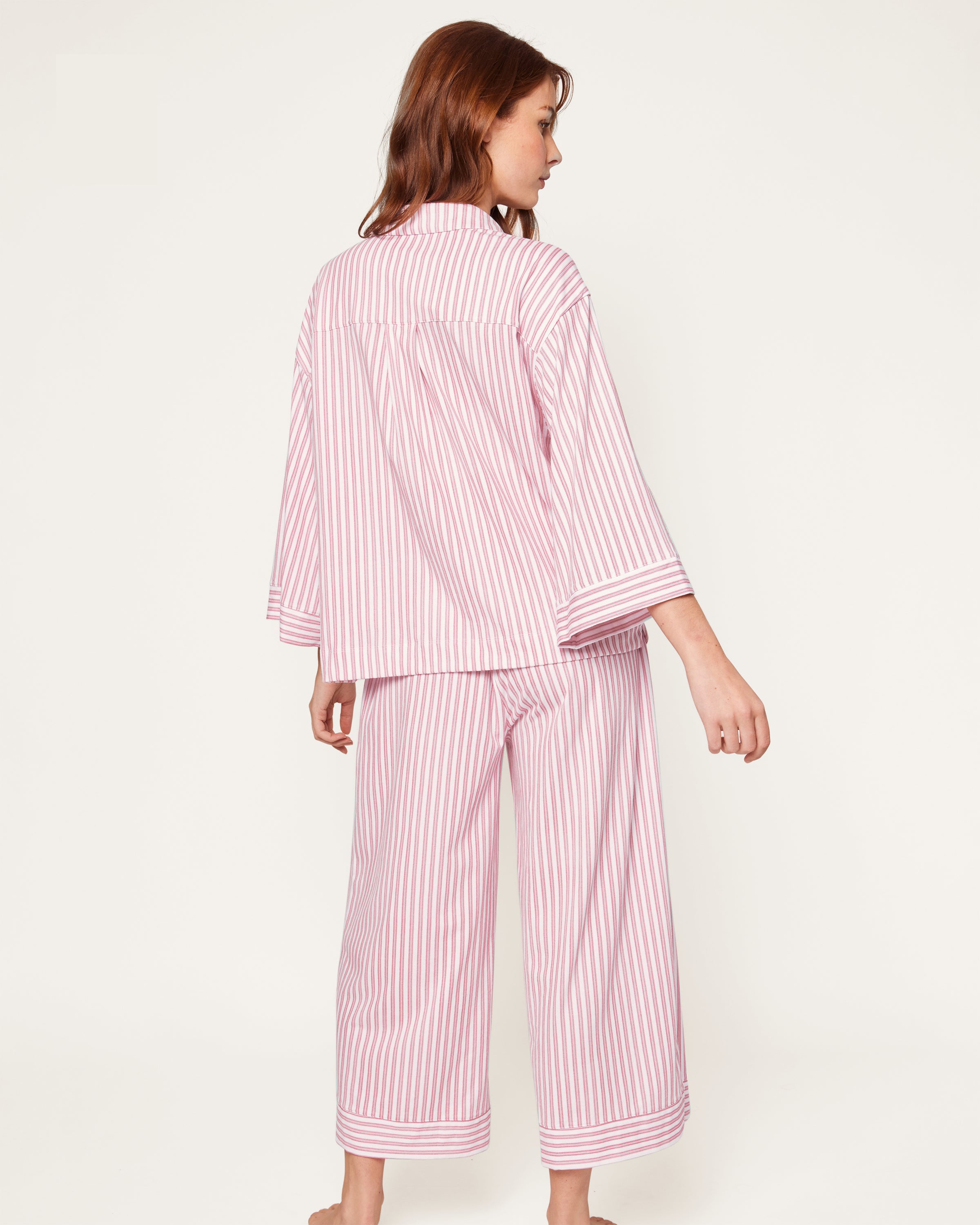 Featuring the Petite Plume Olivia Pajama Set in Antique Red Ticking, this shirt is crafted from luxurious Peruvian Pima cotton with an embroidered logo on its sleeve and a classic white button front design.