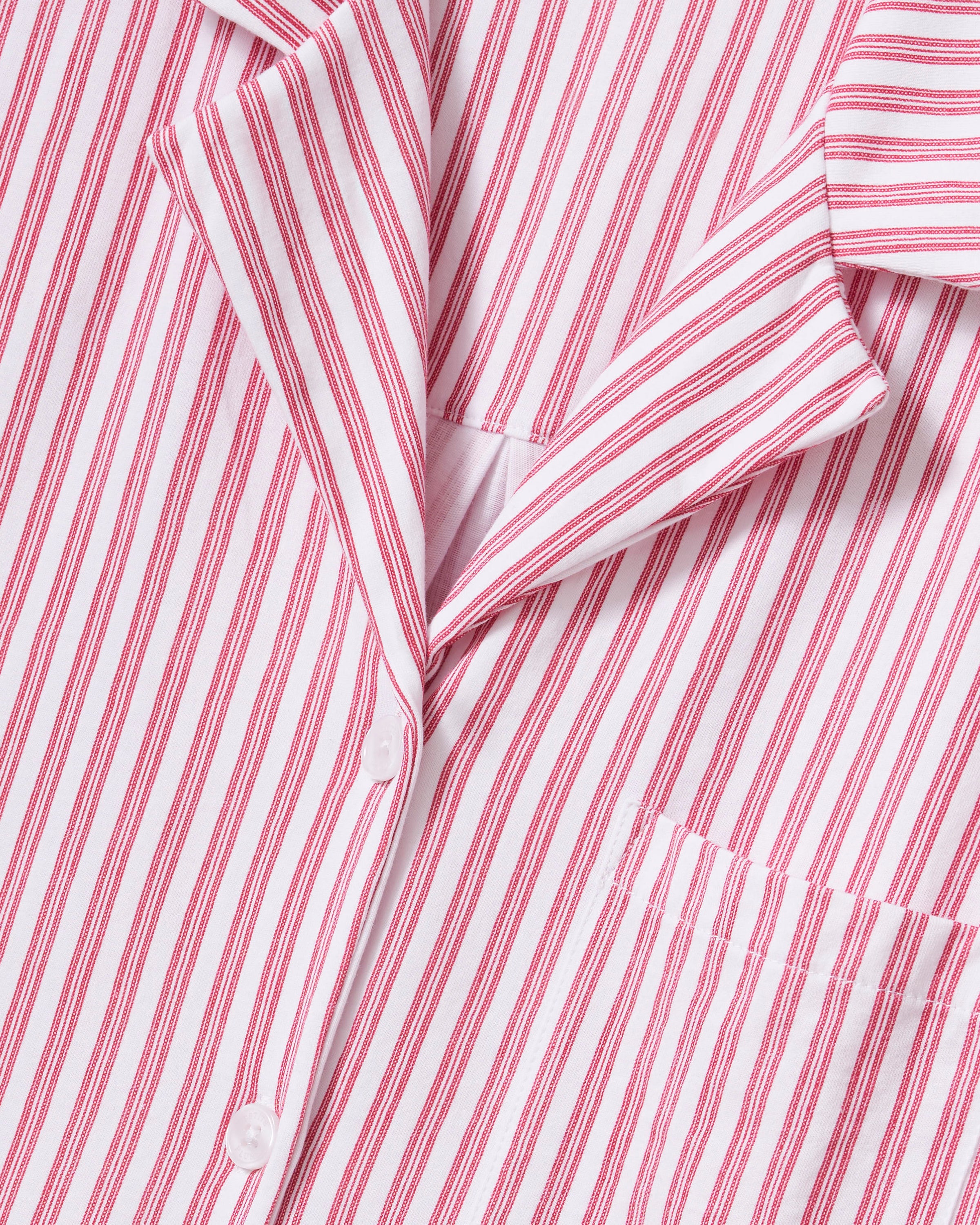 Featuring the Petite Plume Olivia Pajama Set in Antique Red Ticking, this shirt is crafted from luxurious Peruvian Pima cotton with an embroidered logo on its sleeve and a classic white button front design.
