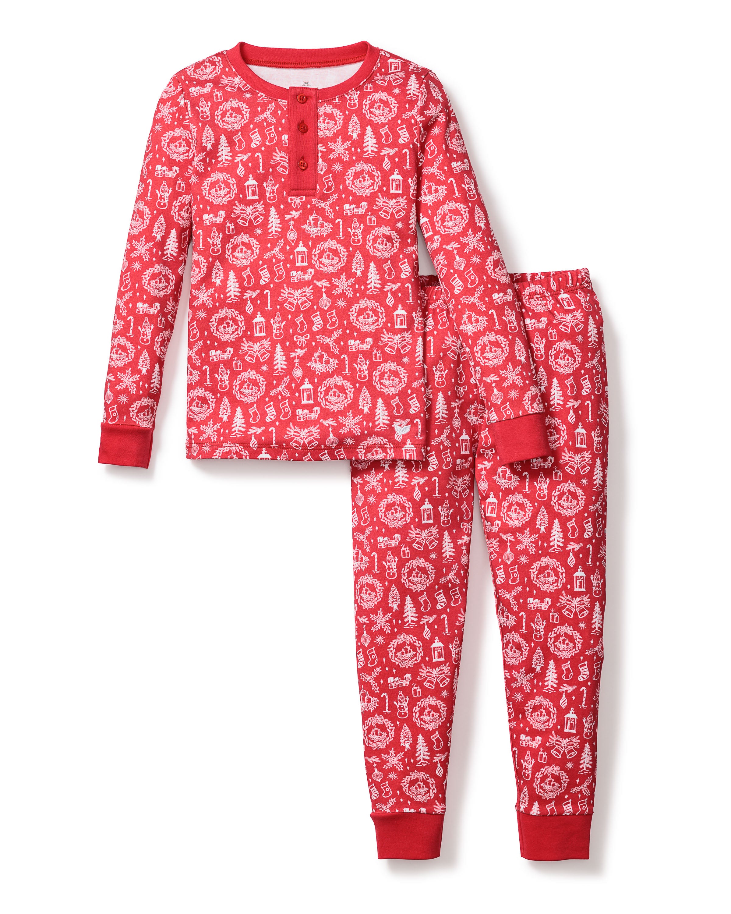 The Kids Pima Snug Fit in Whimsical Winter Saks x PP by Petite Plume features a festive red set with soft Pima cotton. The top has holiday motifs, snowflakes, trees, a round neckline, and button placket; the matching pants come with an elastic waistband for comfort.