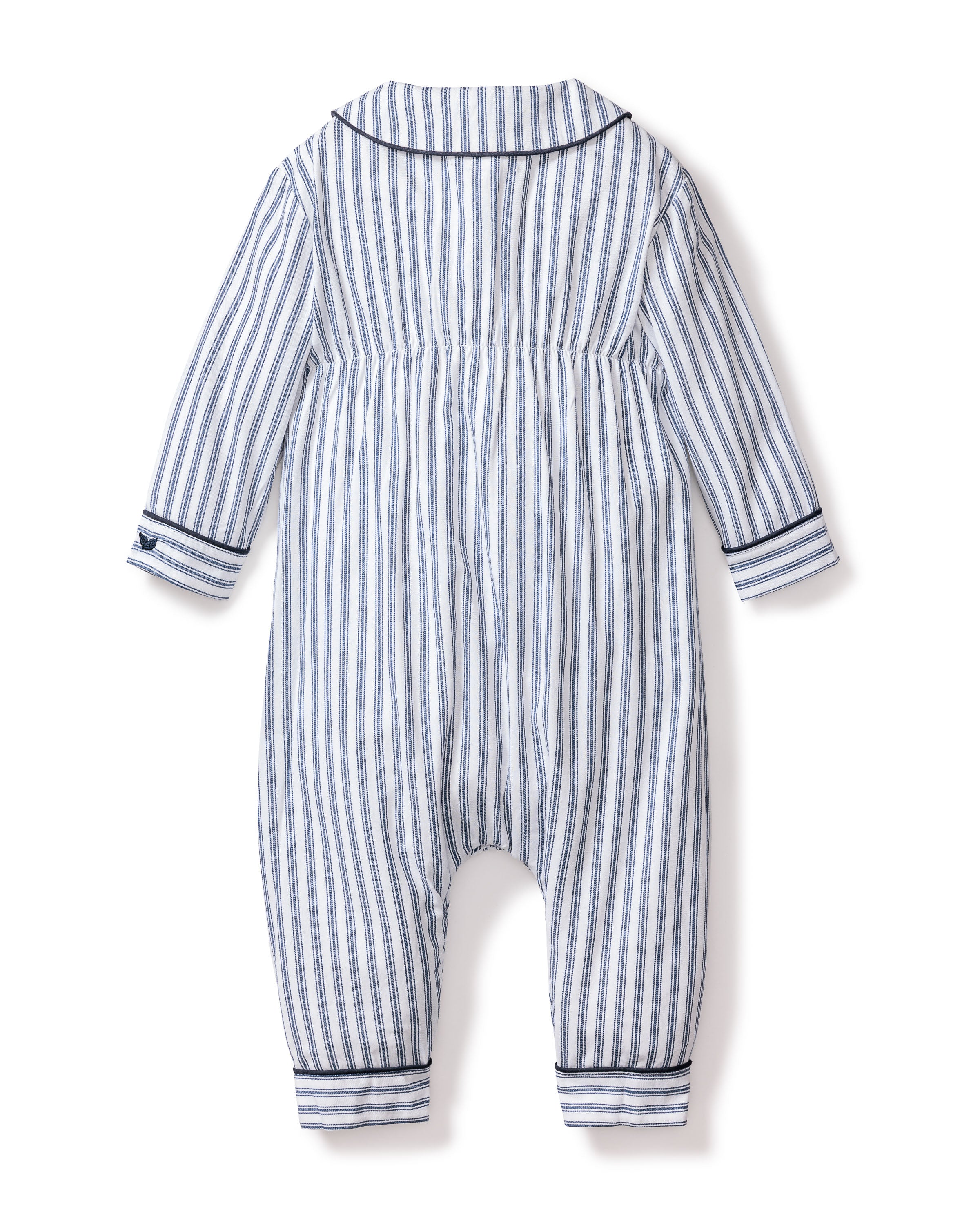 Back view of the Petite Plume Babys Twill Cambridge Romper in Navy French Ticking, featuring blue and white vertical stripes, a collar, cuffed sleeves and ankles with dark trim. Made from soft brushed twill fabric, its ideal for cozy sleepwear.
