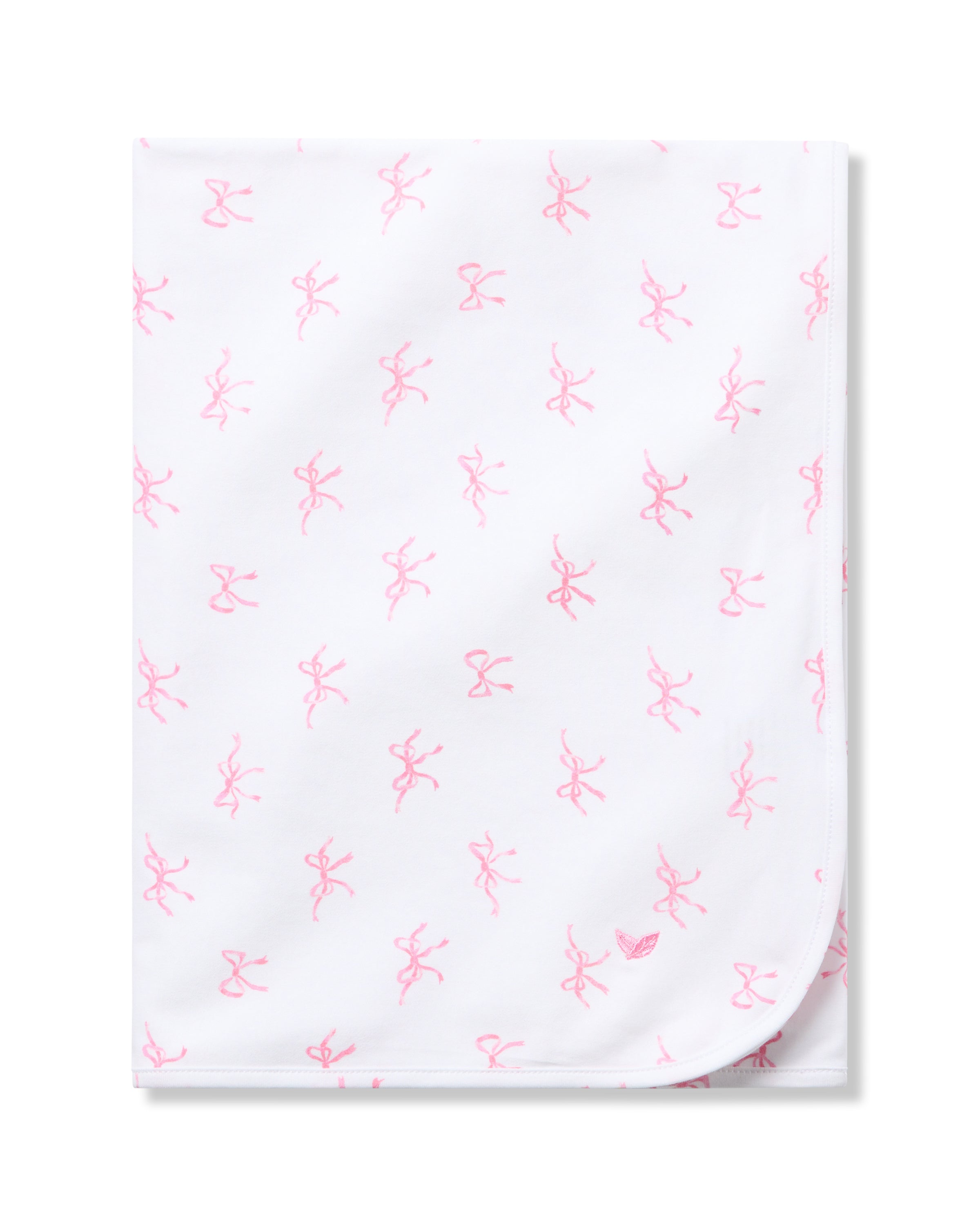 The Petite Plume Pima Baby Blanket in Blushing Bows is crafted from luxurious Peruvian Pima Cotton and features a charming pattern of small pink ballet dancers and bows. Its neatly folded design with visible rounded corners brings elegance to any nursery.