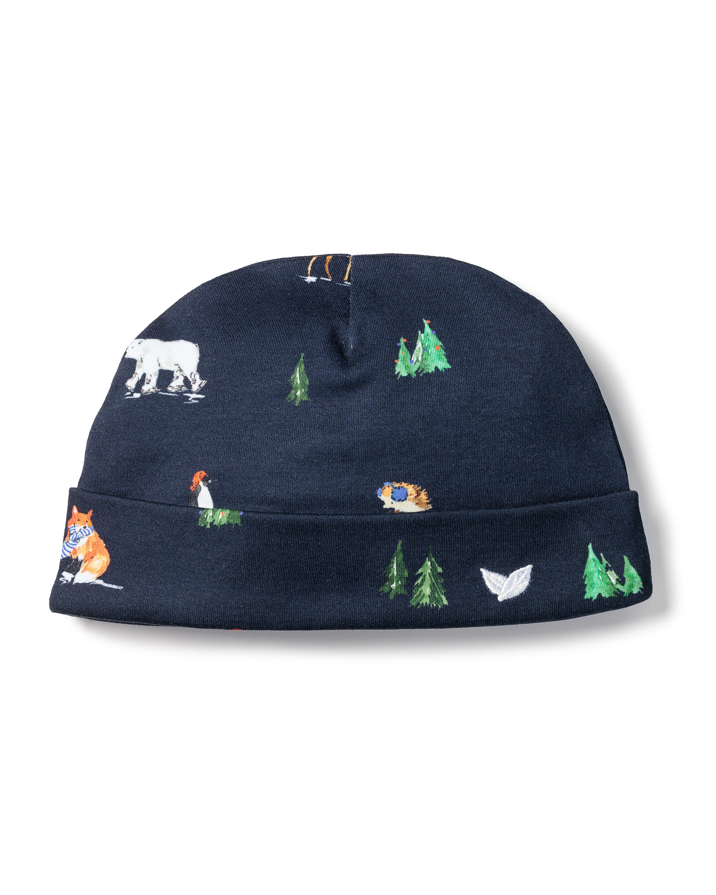 The Petite Plume Babys Pima Hat in Arctic Antics is a navy blue hat made from Peruvian Pima Cotton, adorned with playful patterns of polar bears, foxes, and trees, providing perfect softness for your babys delicate skin.