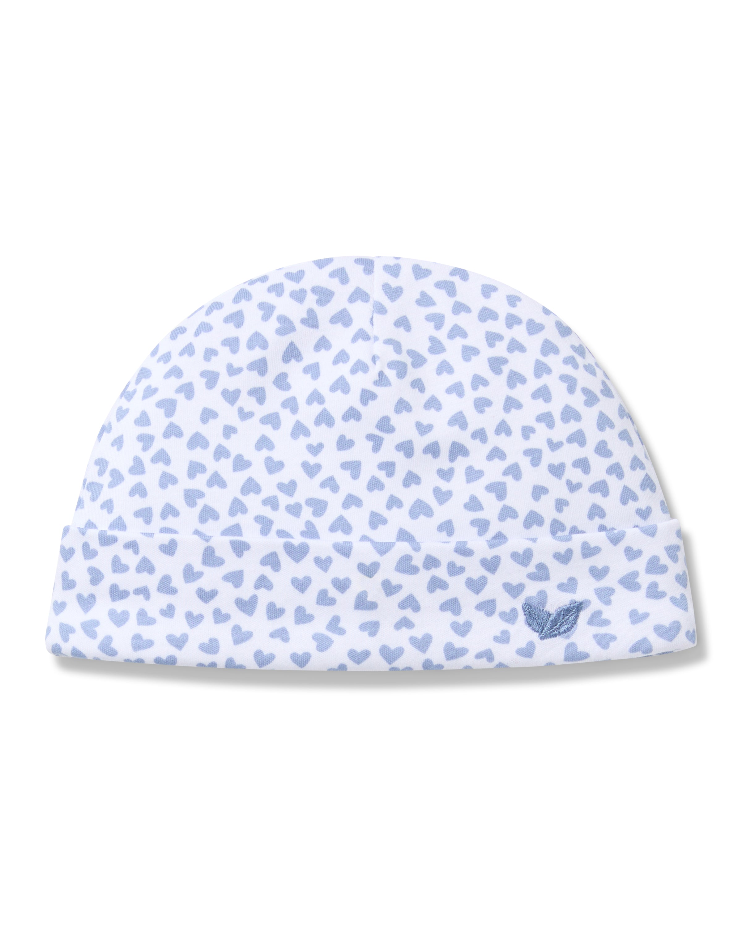 The Petite Plume Babys Pima Hat in Bluehearts is made from luxurious Peruvian Pima Cotton, featuring a cute pattern of small blue hearts and a folded brim with an embroidered blue wing motif, creating a simple, delicate design.