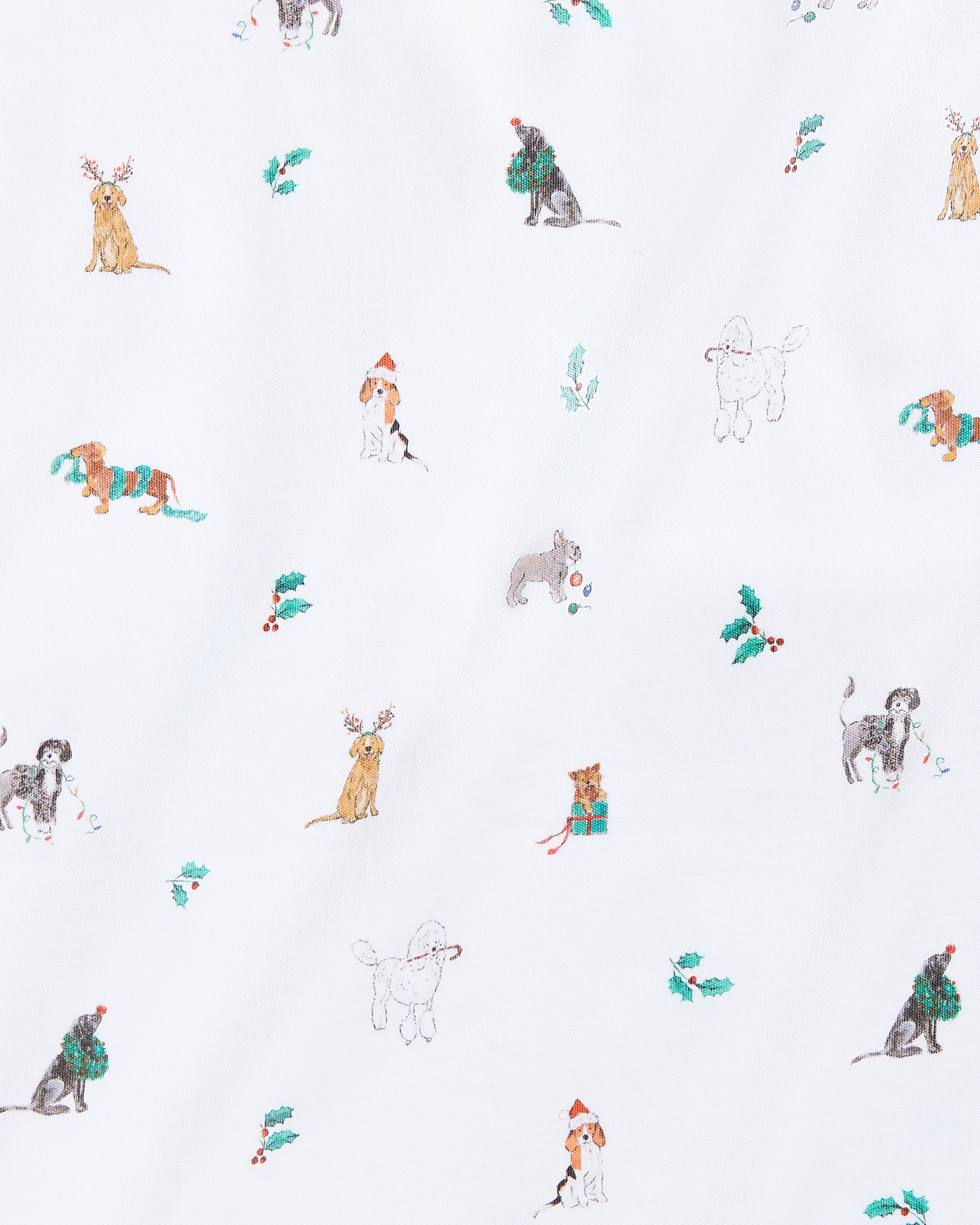 The Kids Pima Snug Fit Pajama Set in Jingle Paws by Petite Plume features a playful dog pattern with festive accessories on soft Pima cotton. The long sleeve top and pant set displays pups carrying presents amid holly leaves on a crisp white background.