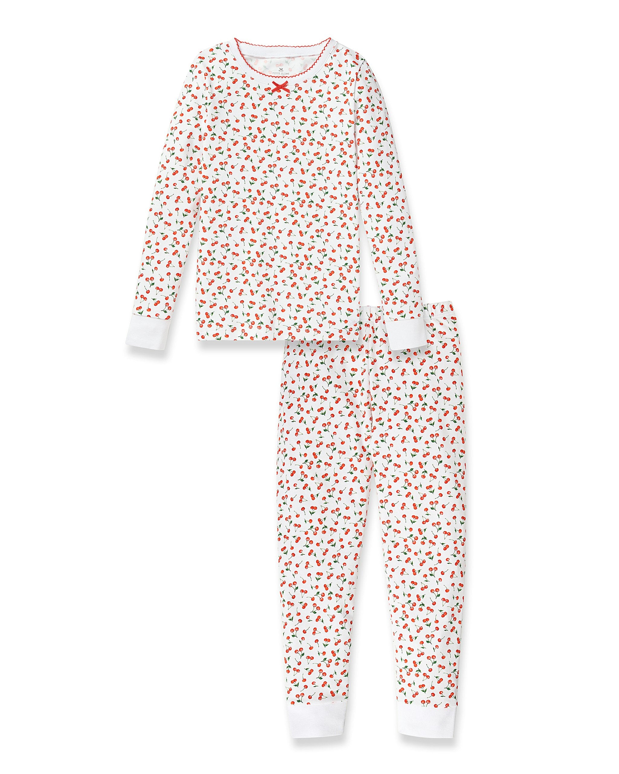 Children's pajama set with red heart pattern on a white background