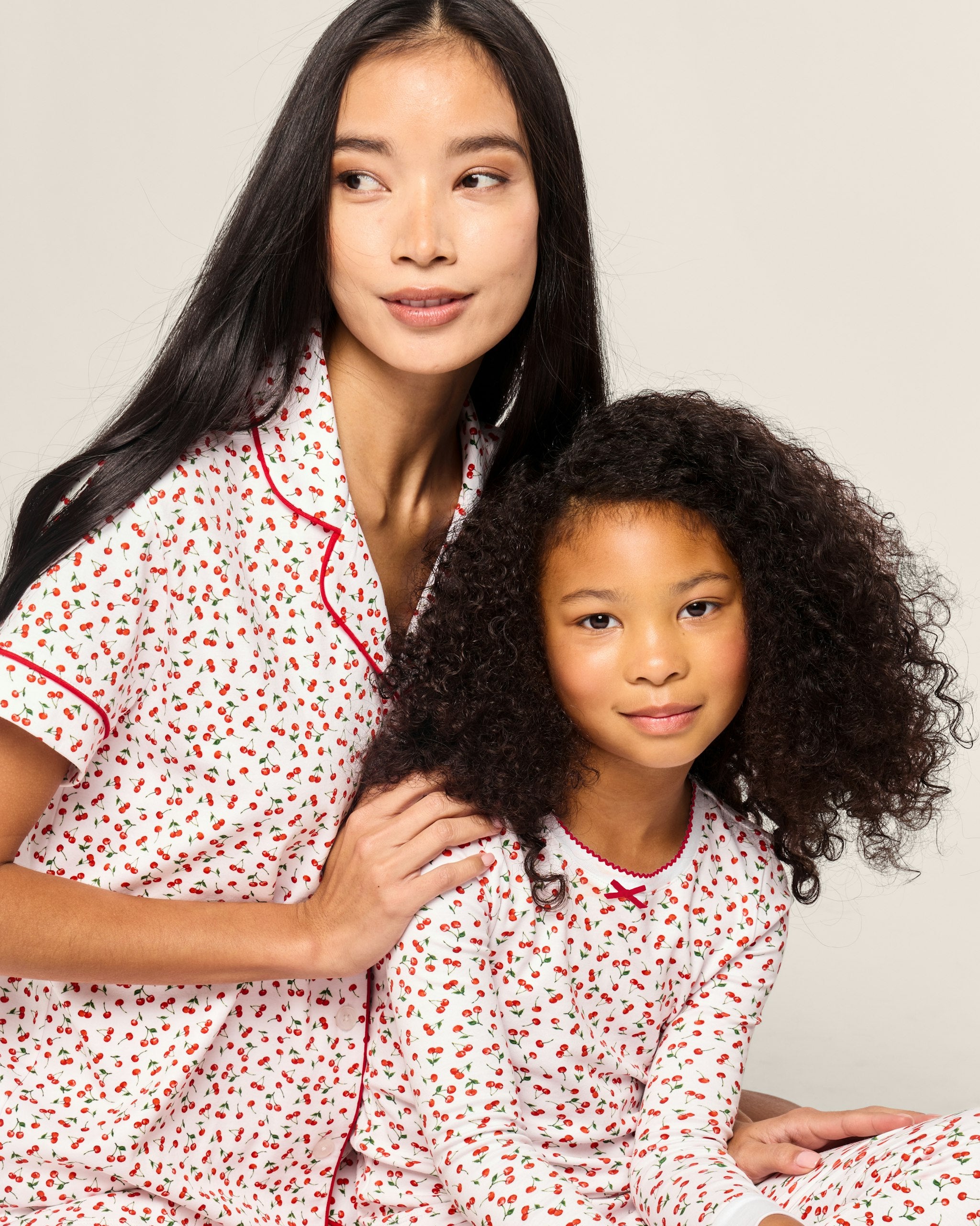 Children's pajama set with red heart pattern on a white background