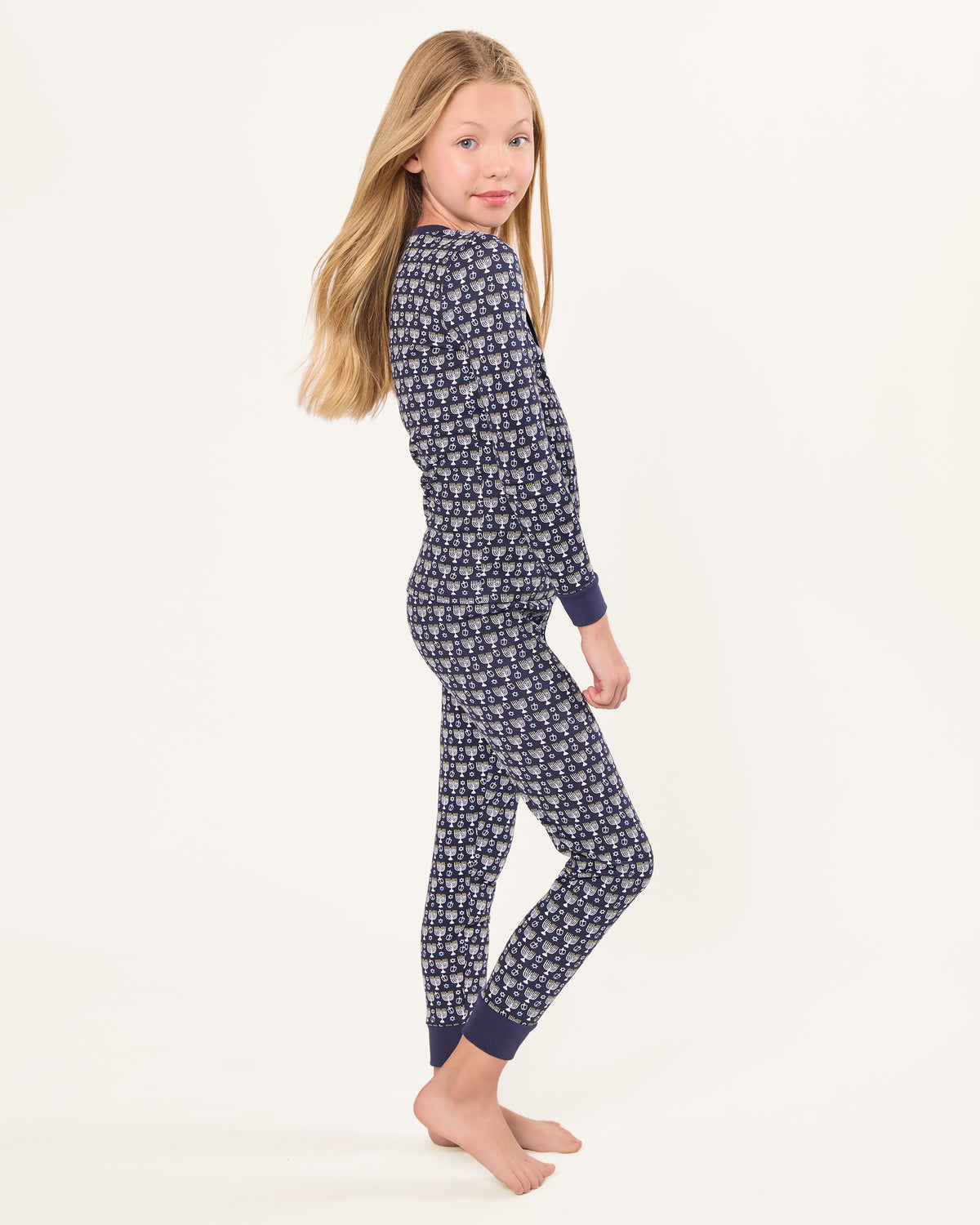 Kid's Pima Snug Fit Pajama Set in Festival of Lights: Navy blue long-sleeve top and pants for kids, with small white and light blue cartoon cats, dark blue cuffs and collar, and three front buttons.