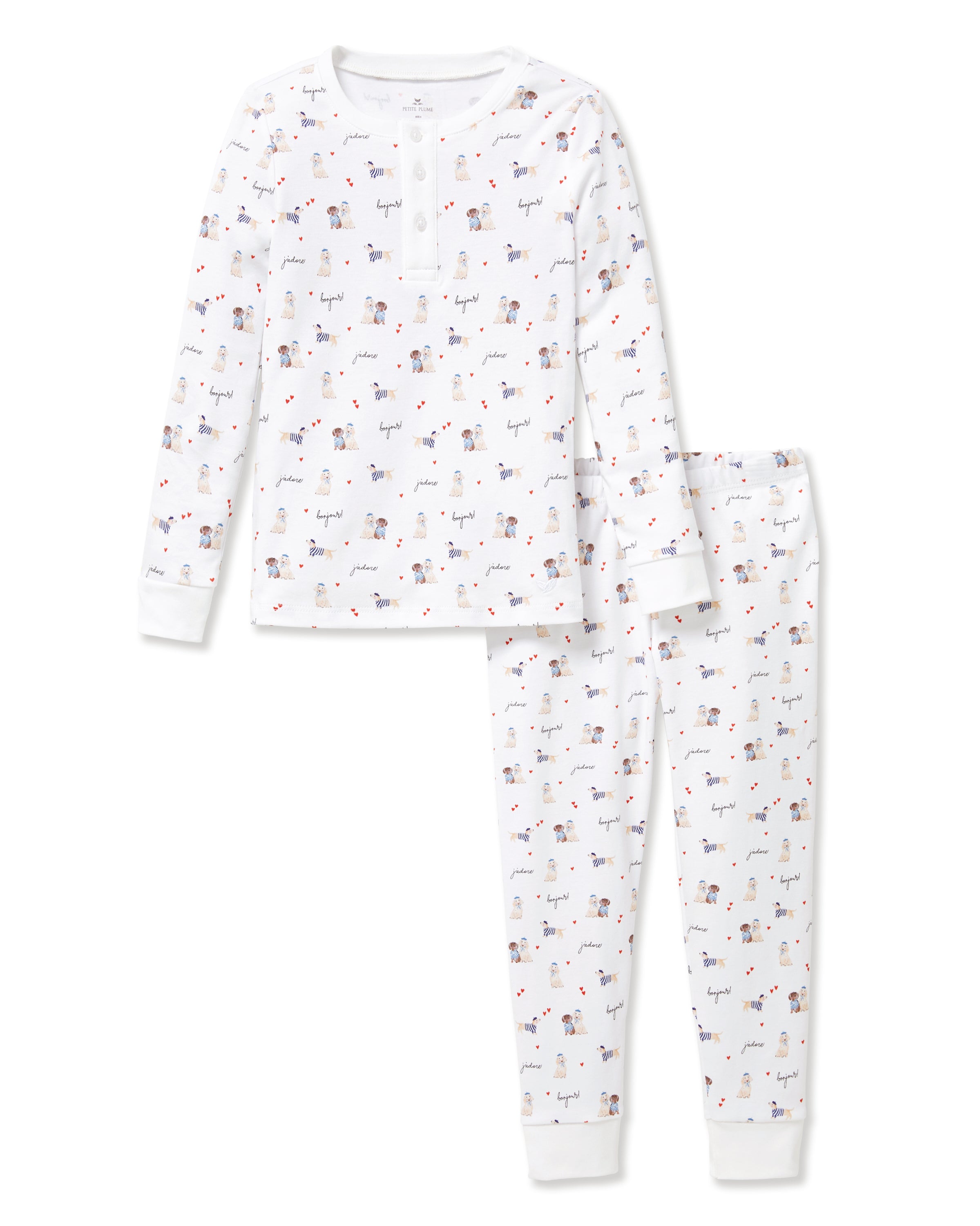 The Kid's Pima Snug Fit Pajama Set in Le Woof is a white long-sleeve pajama set with matching pants, featuring a colorful all-over cartoon dog and bone print, plus cuffed sleeves and ankles for a snug fit.