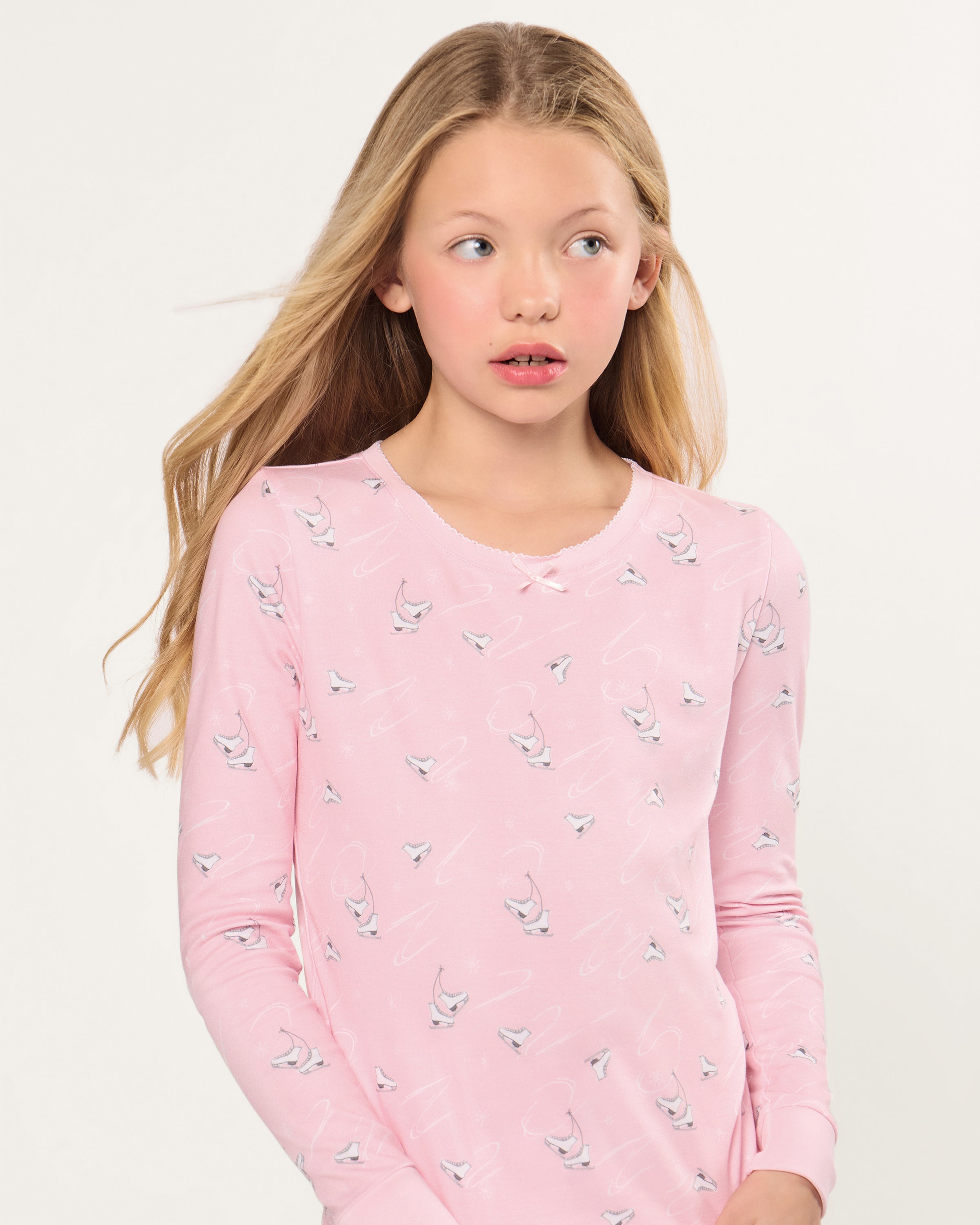 The Kid's Pima Snug Fit Pajama in Winter Skates features a long-sleeved top and pants, displayed flat on a white background.
