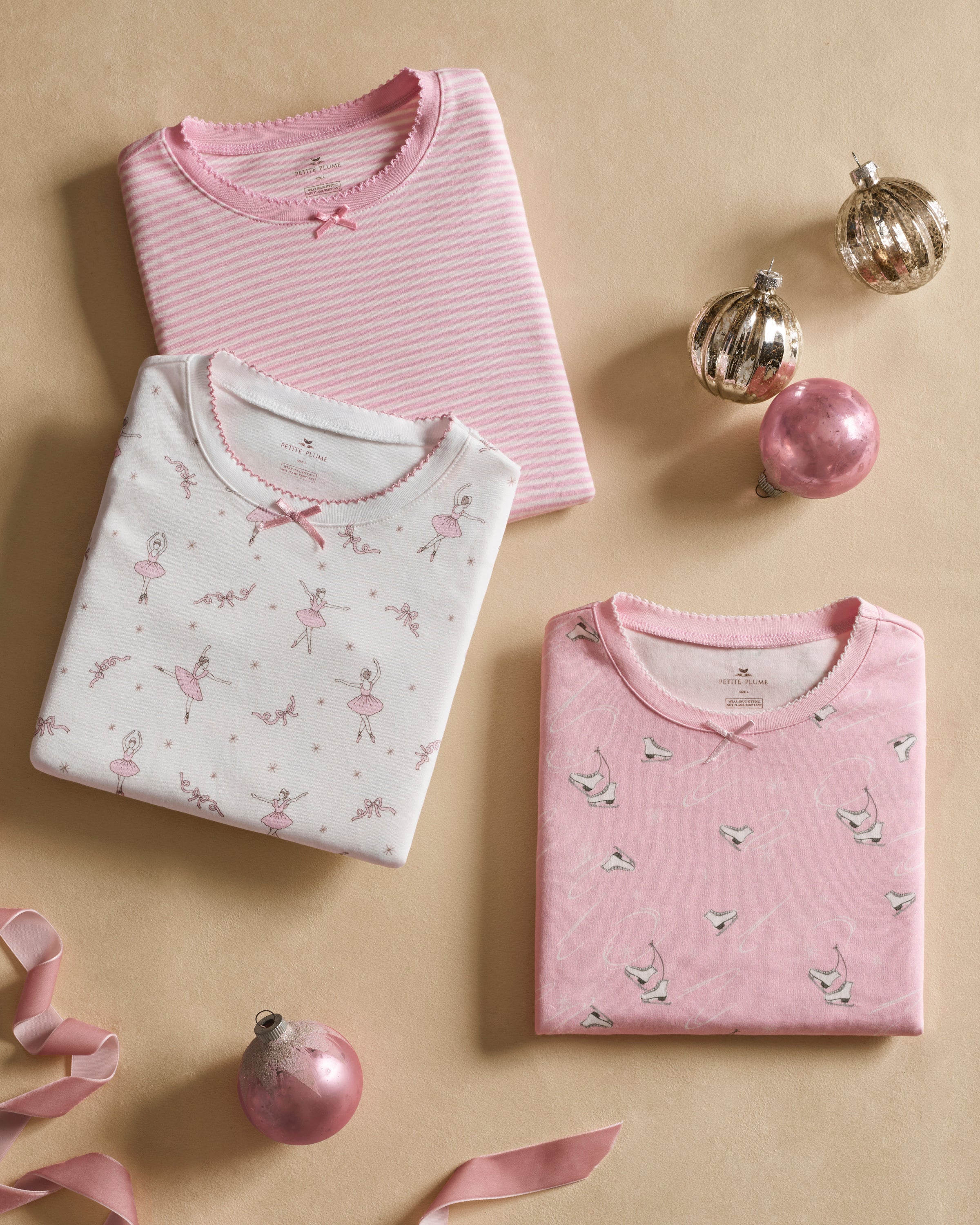 The Kid's Pima Snug Fit Pajama in Winter Skates features a long-sleeved top and pants, displayed flat on a white background.