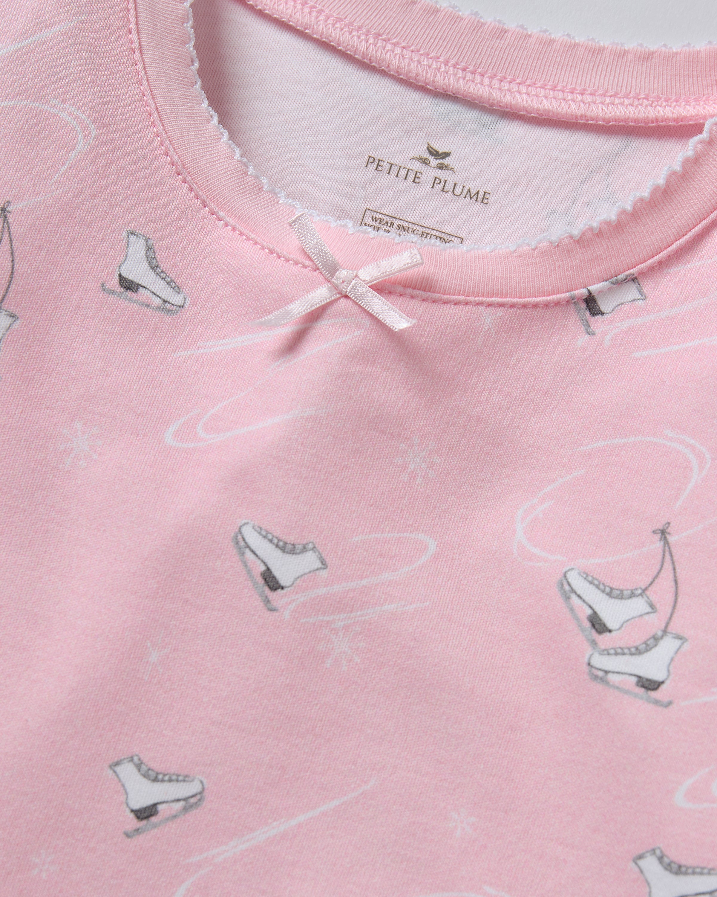 The Kid's Pima Snug Fit Pajama in Winter Skates features a long-sleeved top and pants, displayed flat on a white background.