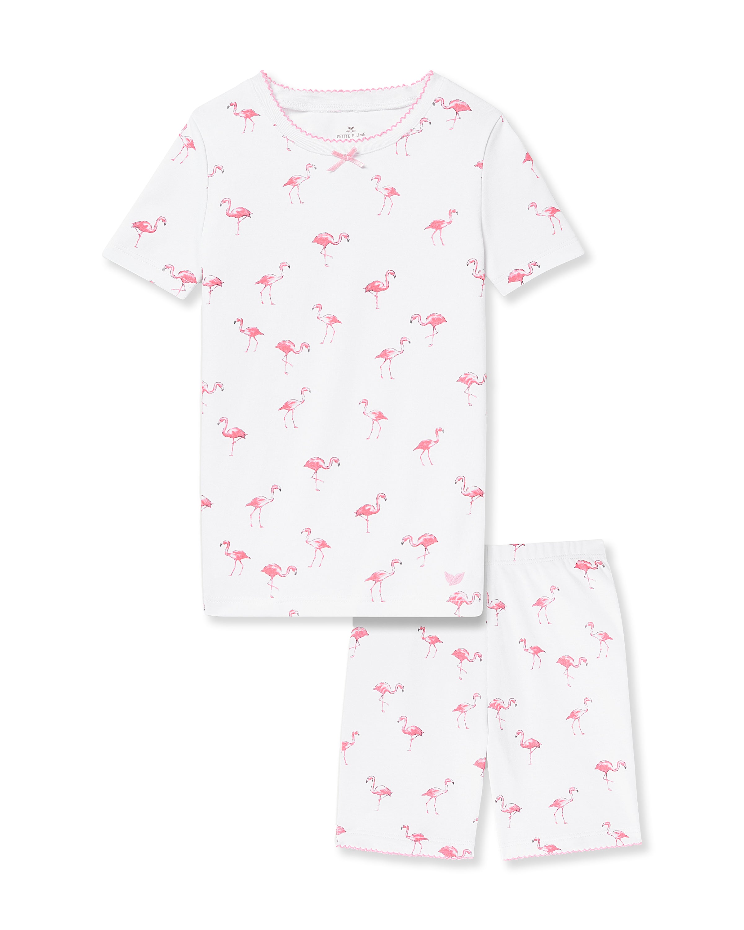 The Petite Plume Kids Pima Snug Fit Short Set in Flamingos features a white short-sleeve top and matching shorts with a playful pink flamingo print, offering ultimate comfort in luxury childrens pajamas.