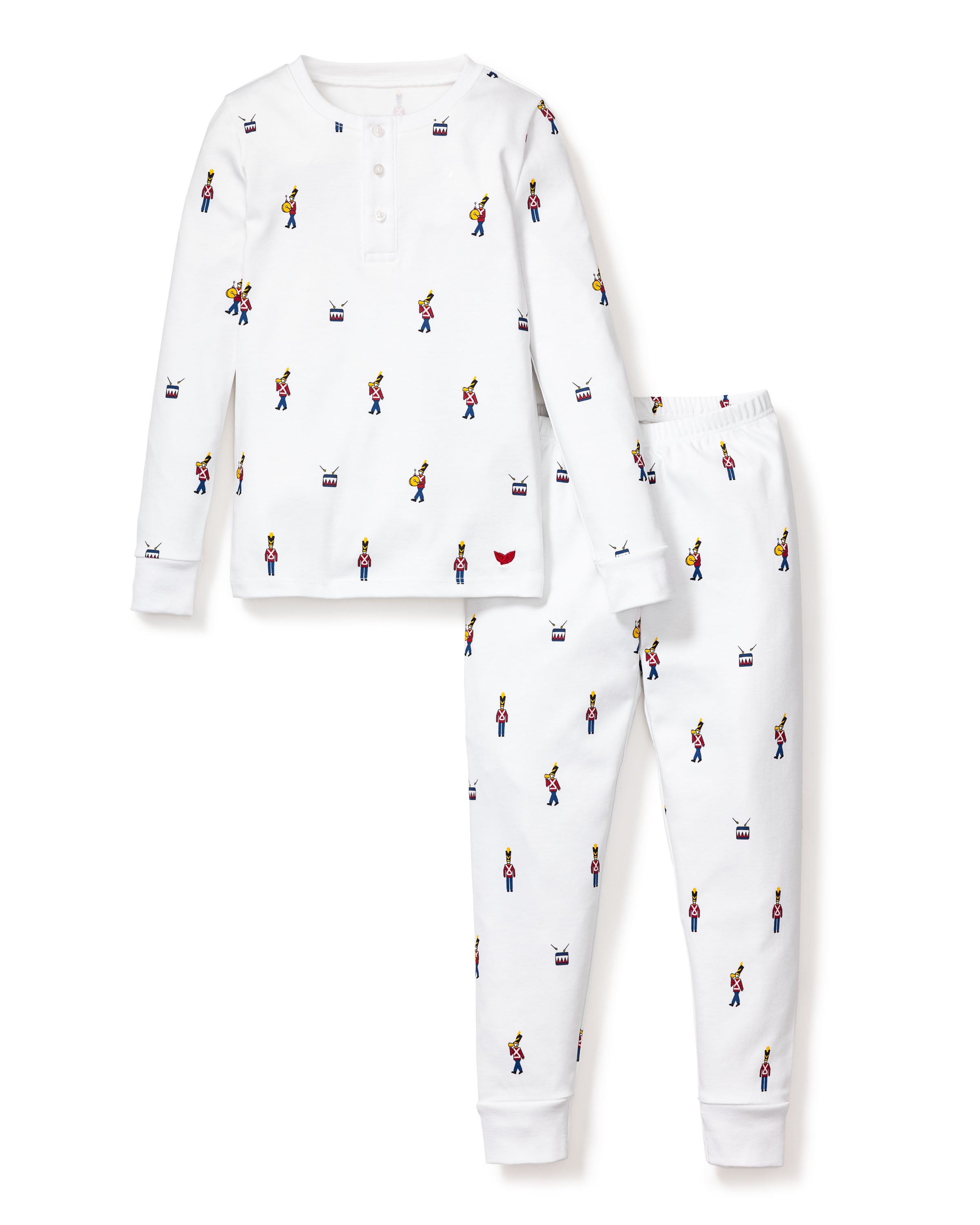 The Kids Pima Snug Fit Pajama Set in Toy Soldier by Petite Plume is a luxurious sleepwear set featuring a white, long-sleeve top and pants. It showcases a colorful pattern of small figures, with button detailing near the collar and an elastic waistband for comfort.
