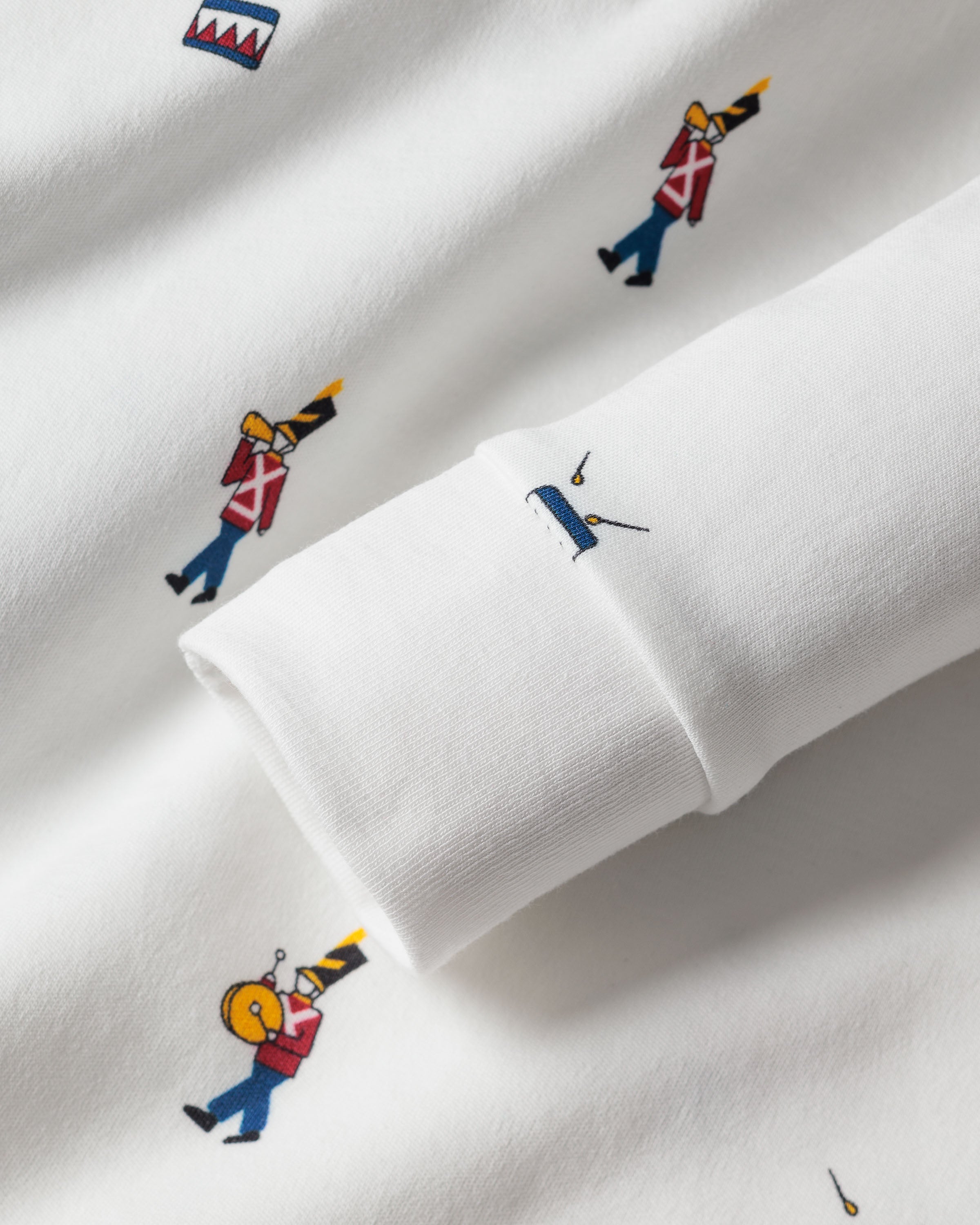Close-up of luxurious Petite Plume Pima Cotton fabric adorned with a vibrant Toy Soldier print. Perfect for the Kids Pima Snug Fit Pajama Set, this fun, evenly distributed pattern makes it ideal for stylish sleepwear.