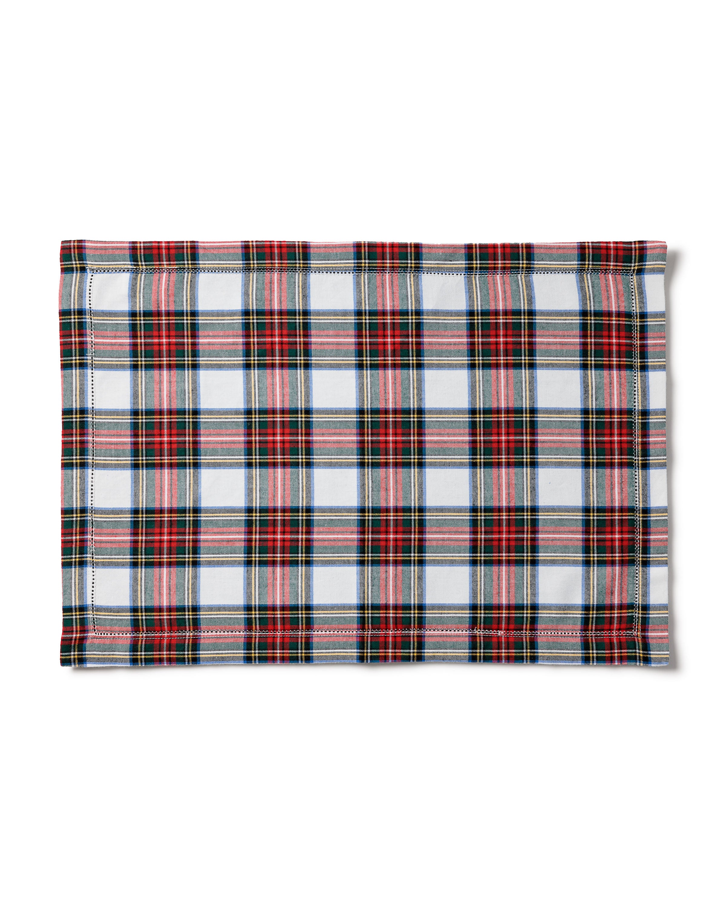 The Signature Twill Placemat in Balmoral Tartan features a rectangular design with a classic red, black, and white plaid pattern and visible stitched edges.