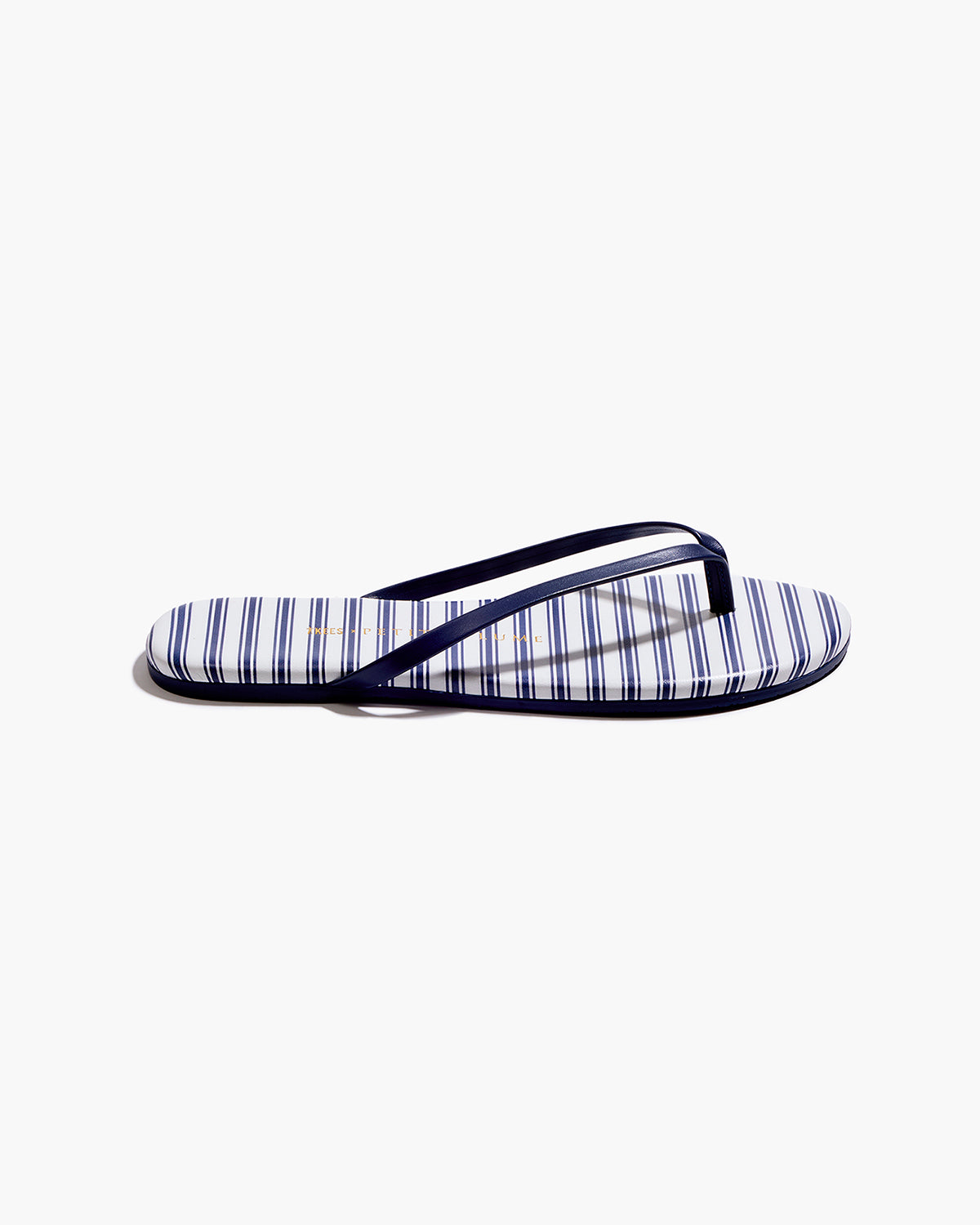 The Petite Plume x TKEES Lily Sandal in Navy French Ticking features blue and white horizontal stripes with dark blue straps, displayed side by side on a white background.