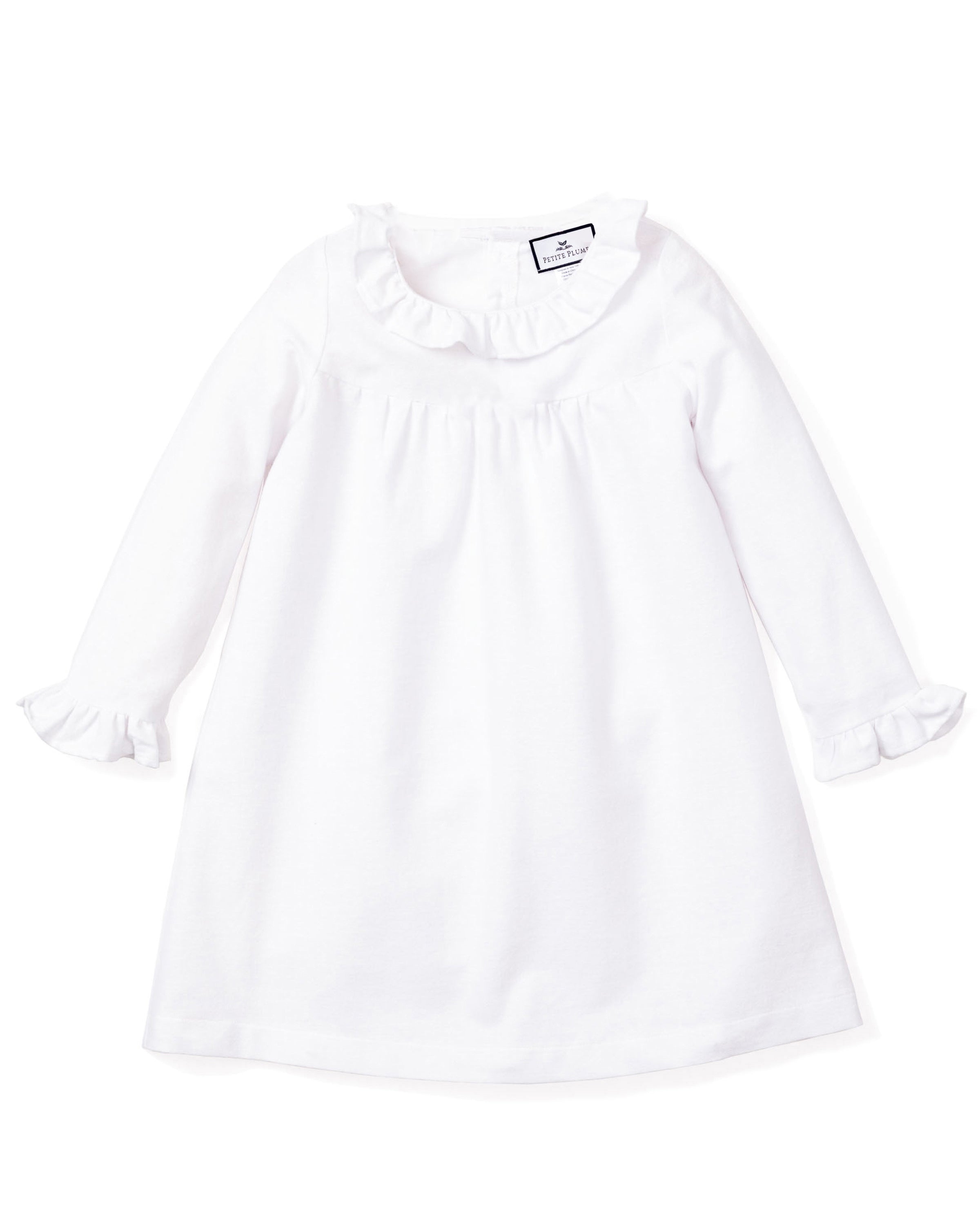 The Petite Plume Kids Scarlett Flannel Nightgown in White features a small ruffled collar and sleeve cuffs, with a simple, elegant design crafted from luxurious cotton sleepwear fabric.