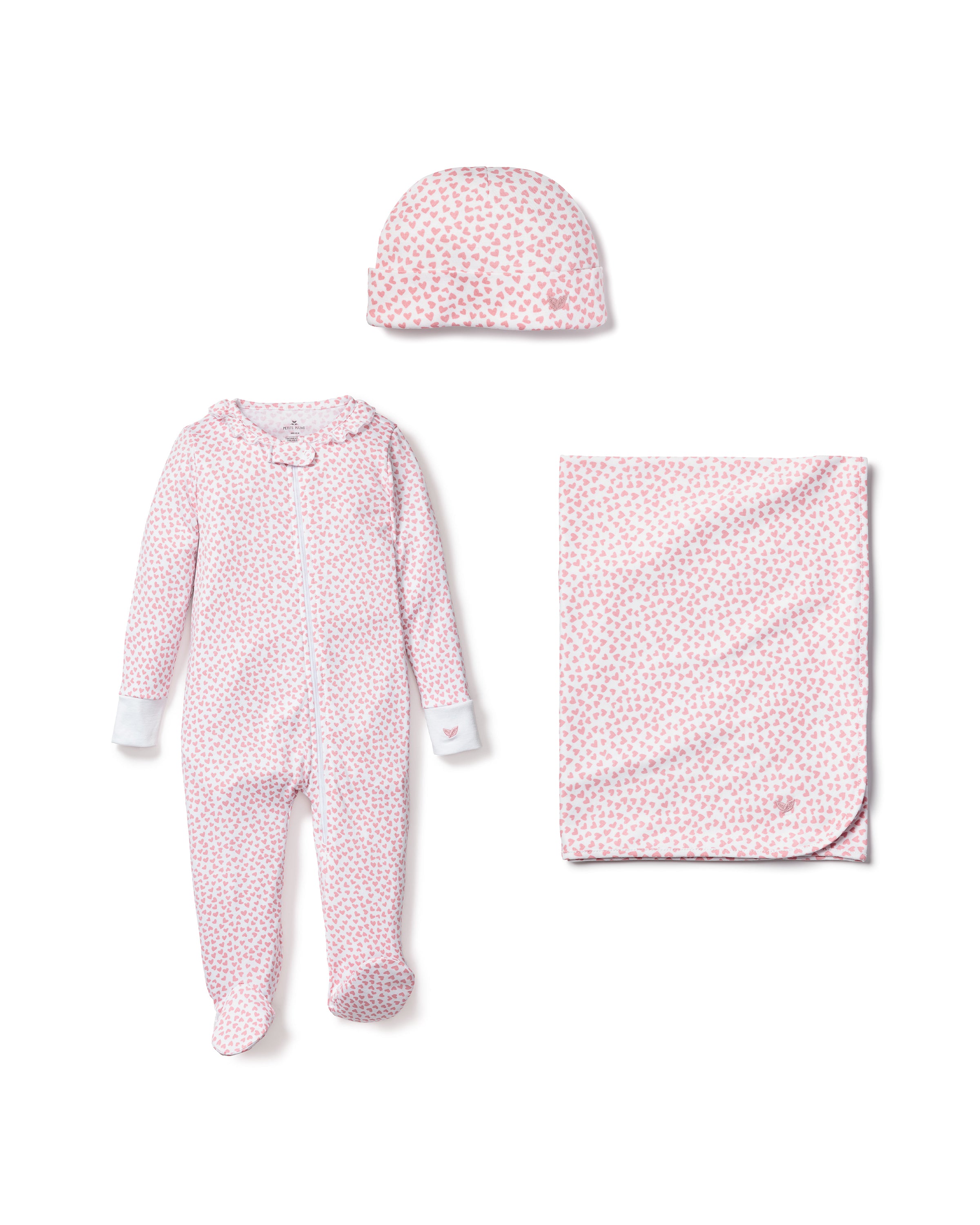 The Welcome Home Baby Set - Sweethearts by Petite Plume features a luxury pink floral long-sleeve footed onesie with a zipper, matching beanie, and cozy blanket. This perfect baby gift bundle keeps your little one snug and stylish.