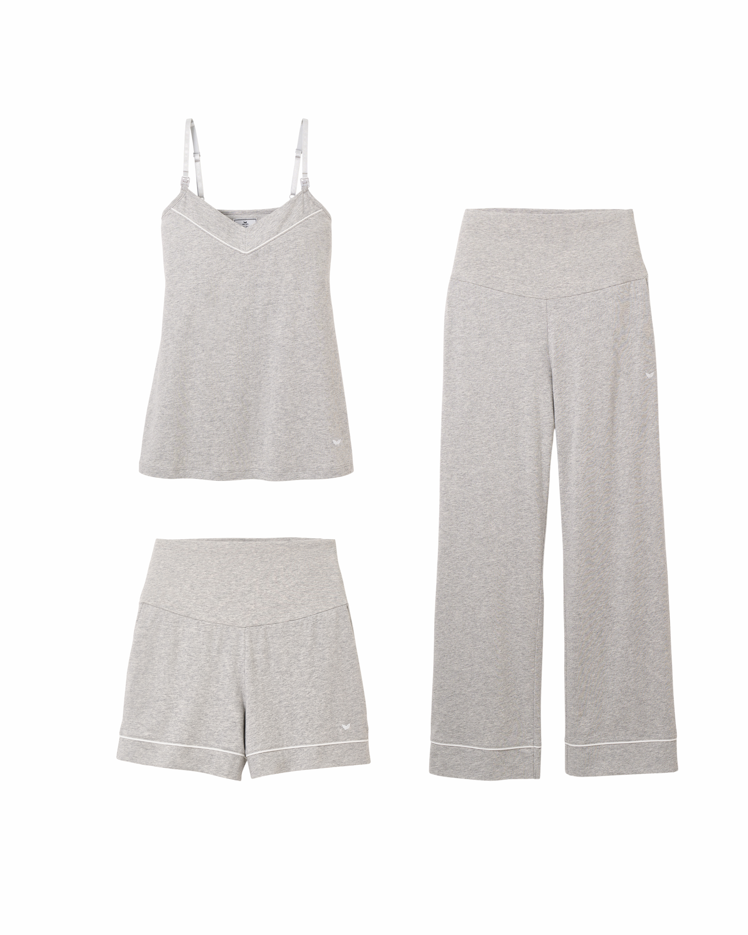 The Basics Maternity Set in Light Heather Grey by Petite Plume is a cozy three-piece loungewear collection featuring a camisole with thin straps, long wide-leg pants, and shorts. Made from soft Pima cotton, each piece has a subtle side logo for added elegance.