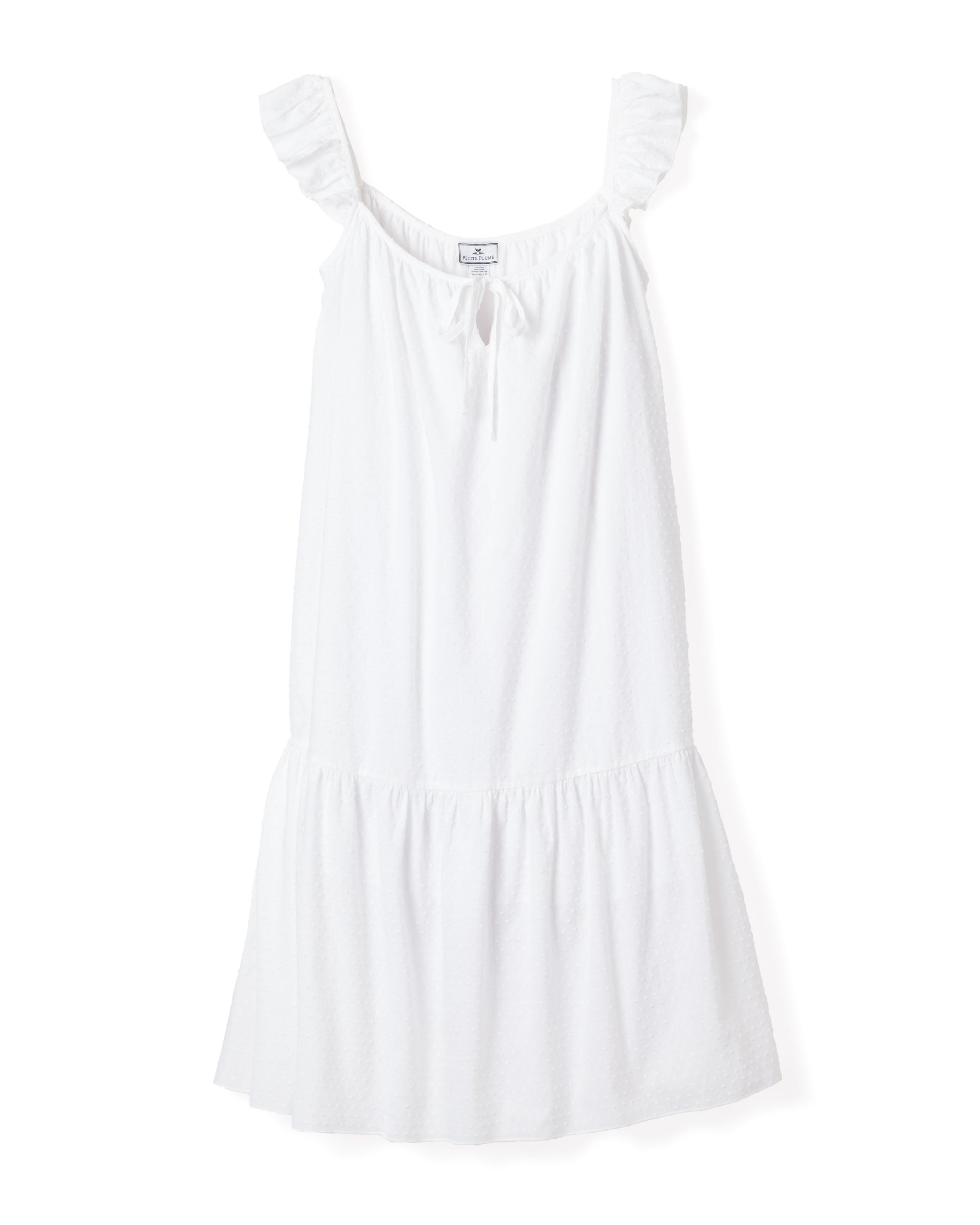 Petite Plumes Womens Swiss Dots Celeste Nightgown in White features a sleeveless design with ruffled shoulder straps, gathered wide hem, and textured fabric. It boasts a front tie detail at the neckline and offers a loose, flowing silhouette perfect for casual or summer occasions.