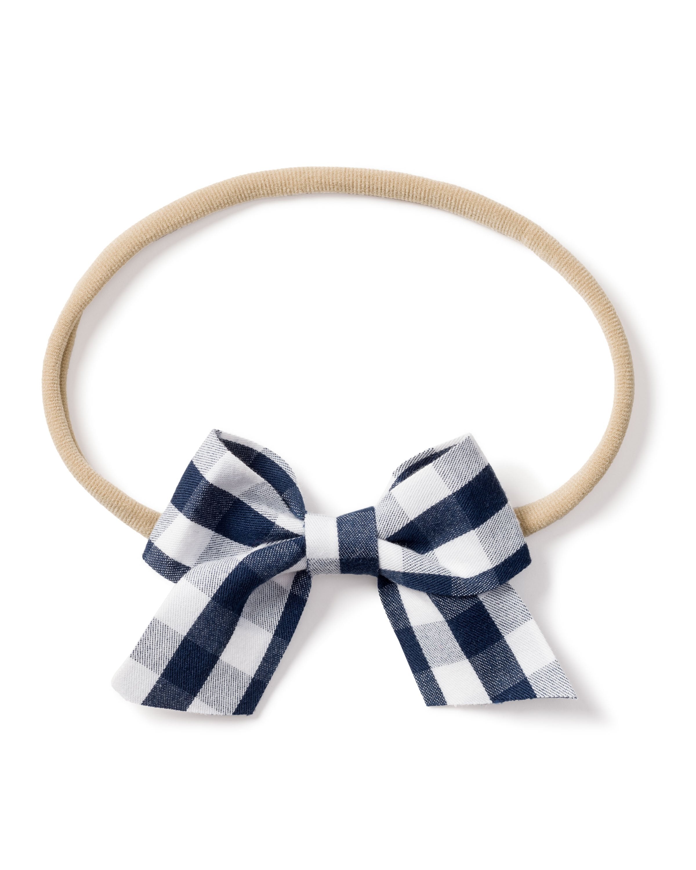 The Petite Plume Girls Hair Bows in Navy Gingham feature a charming black-and-white checkered bow with a beige elastic band, adding a stylish touch to any girls outfit.