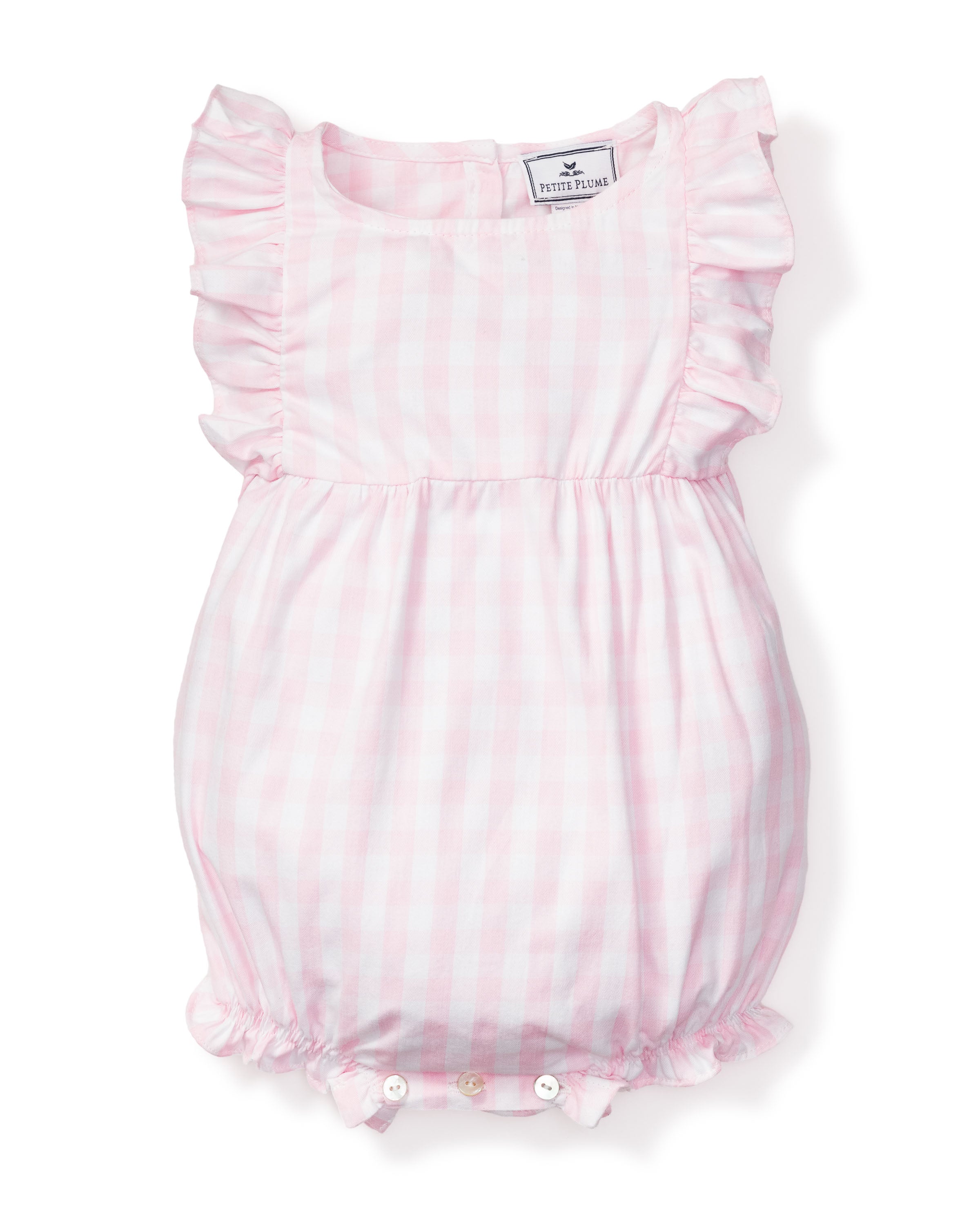 The Babys Twill Ruffled Romper in Pink Gingham by Petite Plume features ruffled sleeves, a cinched waist, leg openings, and two small buttons at the bottom for a snug fit during playful nights.