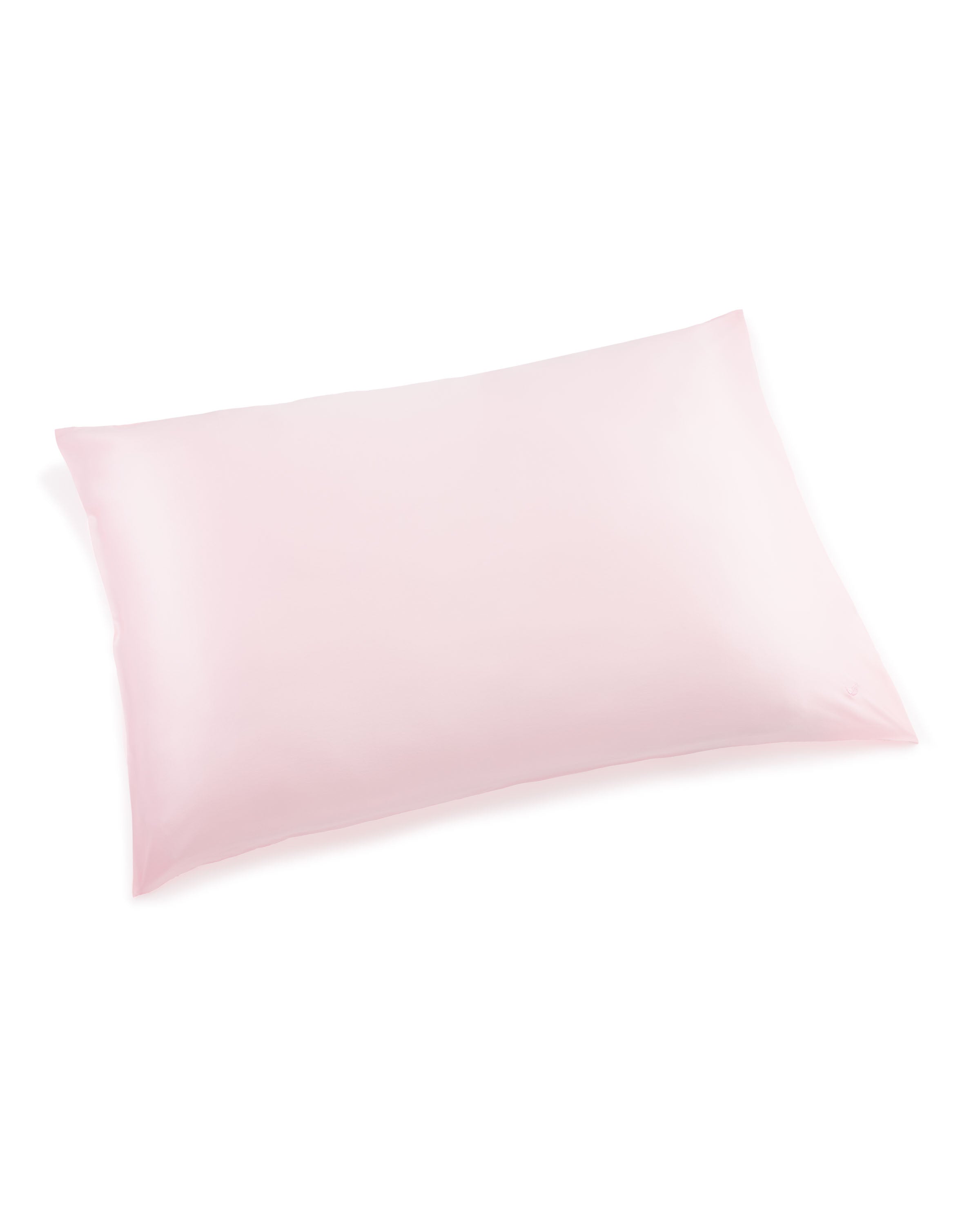 A Silk Pillow Cover in Pink by Petite Plume is showcased flat on a white background, crafted from premium 22mm silk. It has a smooth, glossy texture and an elegant design that promises sweet dreams.
