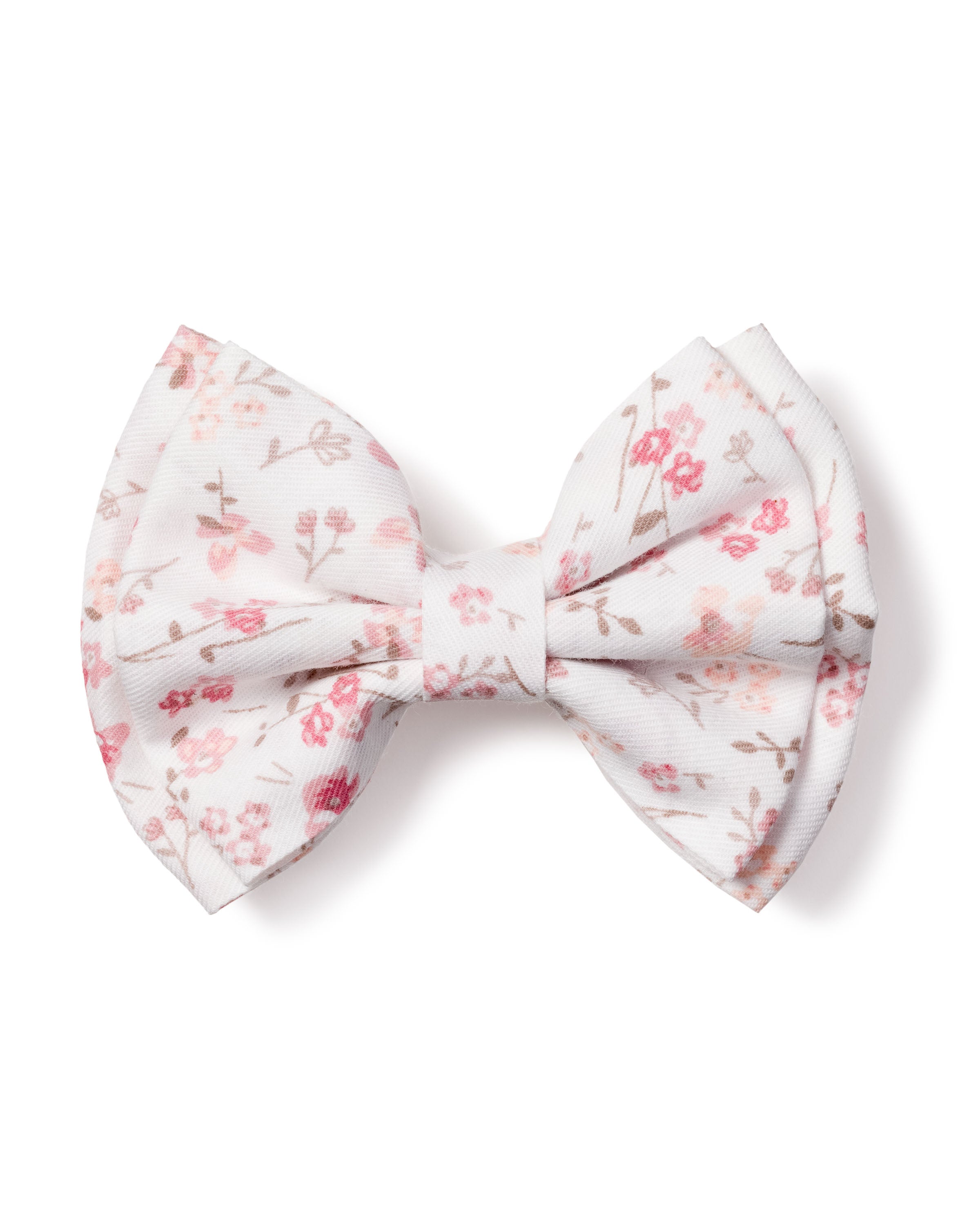 The Girls Dorset Floral Hair Bow by Petite Plume showcases a charming floral pattern in pink and light brown with small flowers and delicate branches, making it an ideal holiday gift or stocking stuffer.