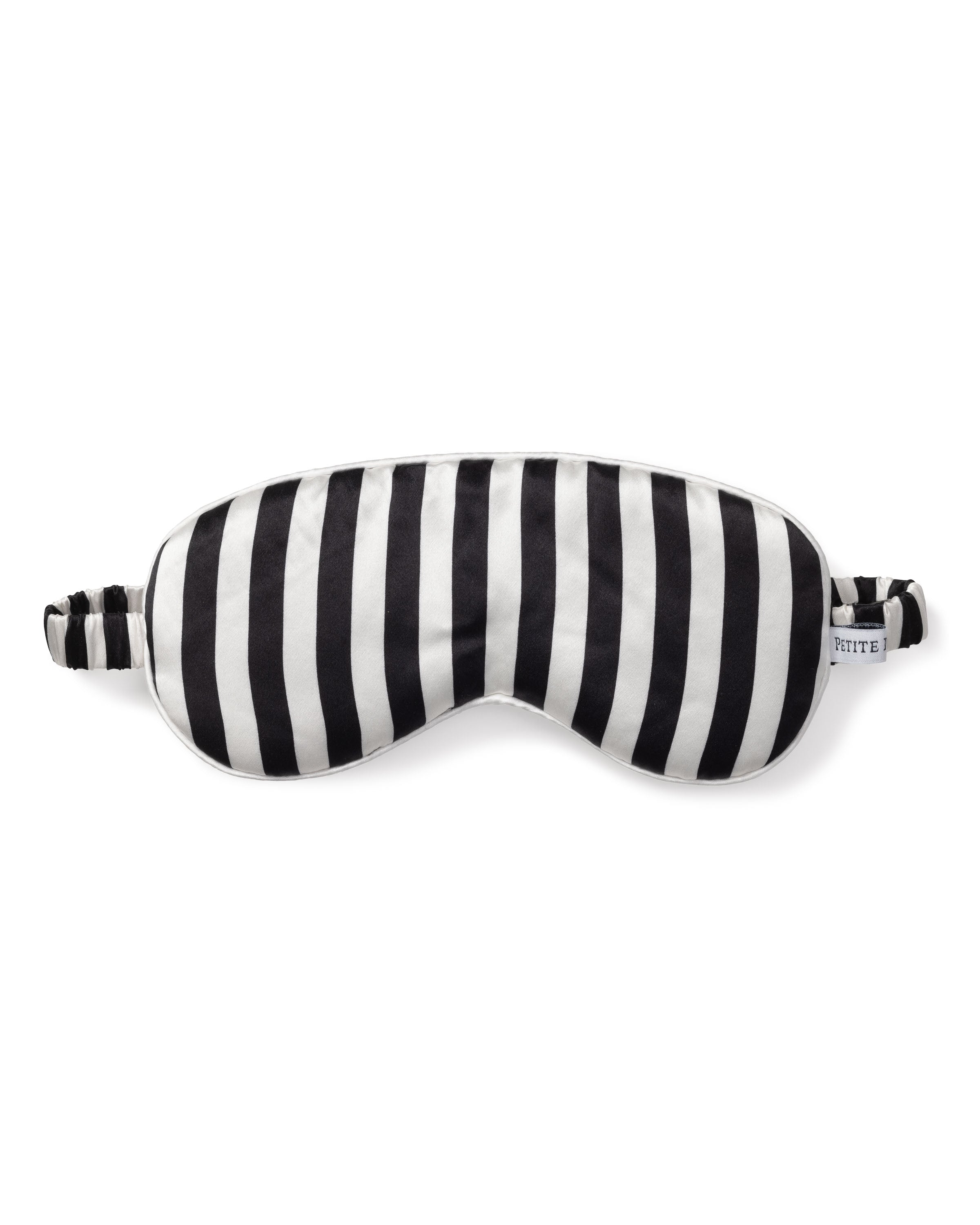 The Adults Silk Sleep Mask in Bengal Stripe by Petite Plume, crafted from pure silk, features a black and white stripe design with an adjustable elastic band, promising sweet dreams against a plain white background.