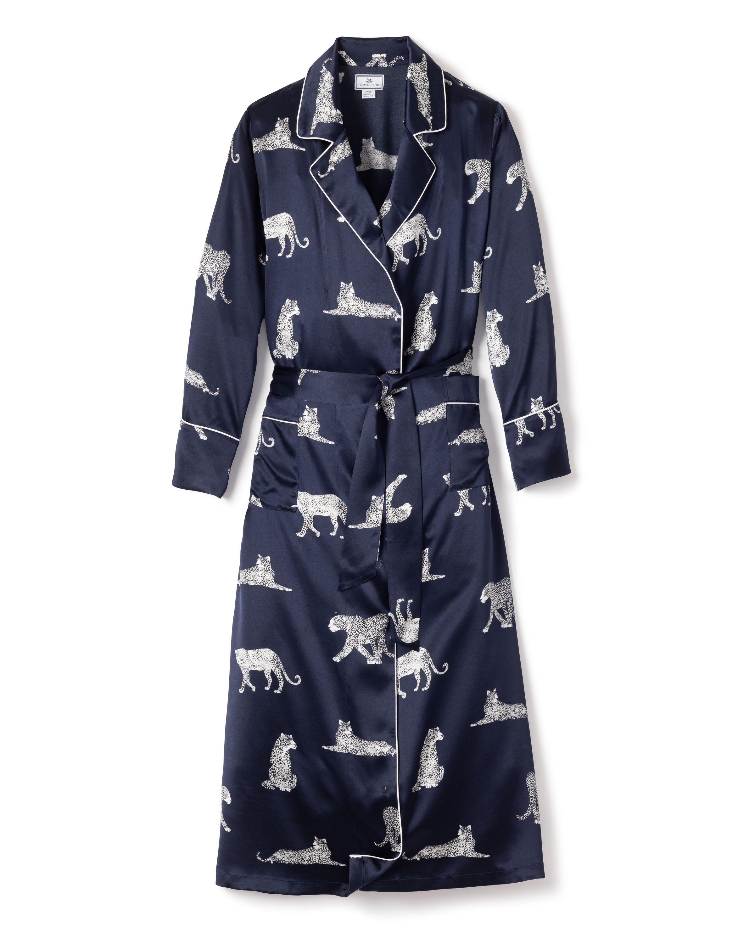 Petite Plumes Womens Silk Long Robe in Panthère de Nuit is a navy blue luxury robe with white piping and belt, featuring Mulberry silk adorned with white cheetahs in various poses for classic Hollywood style elegance.