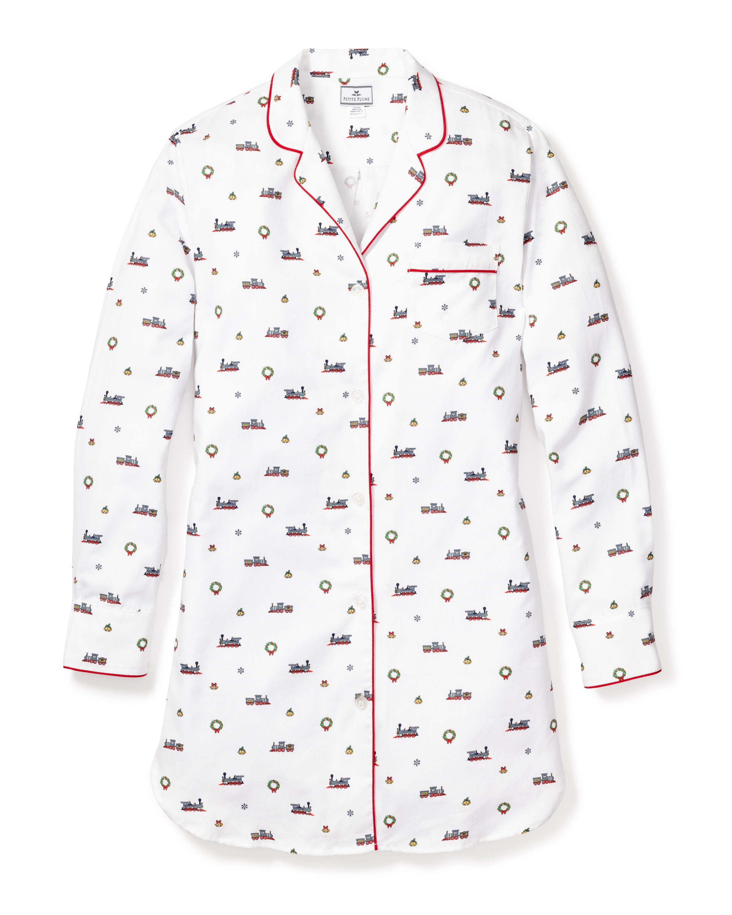The Womens Twill Nightshirt in Arctic Express by Petite Plume is a white cotton twill pajama shirt with long sleeves, featuring small colorful prints of hot air balloons and buildings, red piping on the collar, cuffs, and pocket, and a button-down front with white buttons.