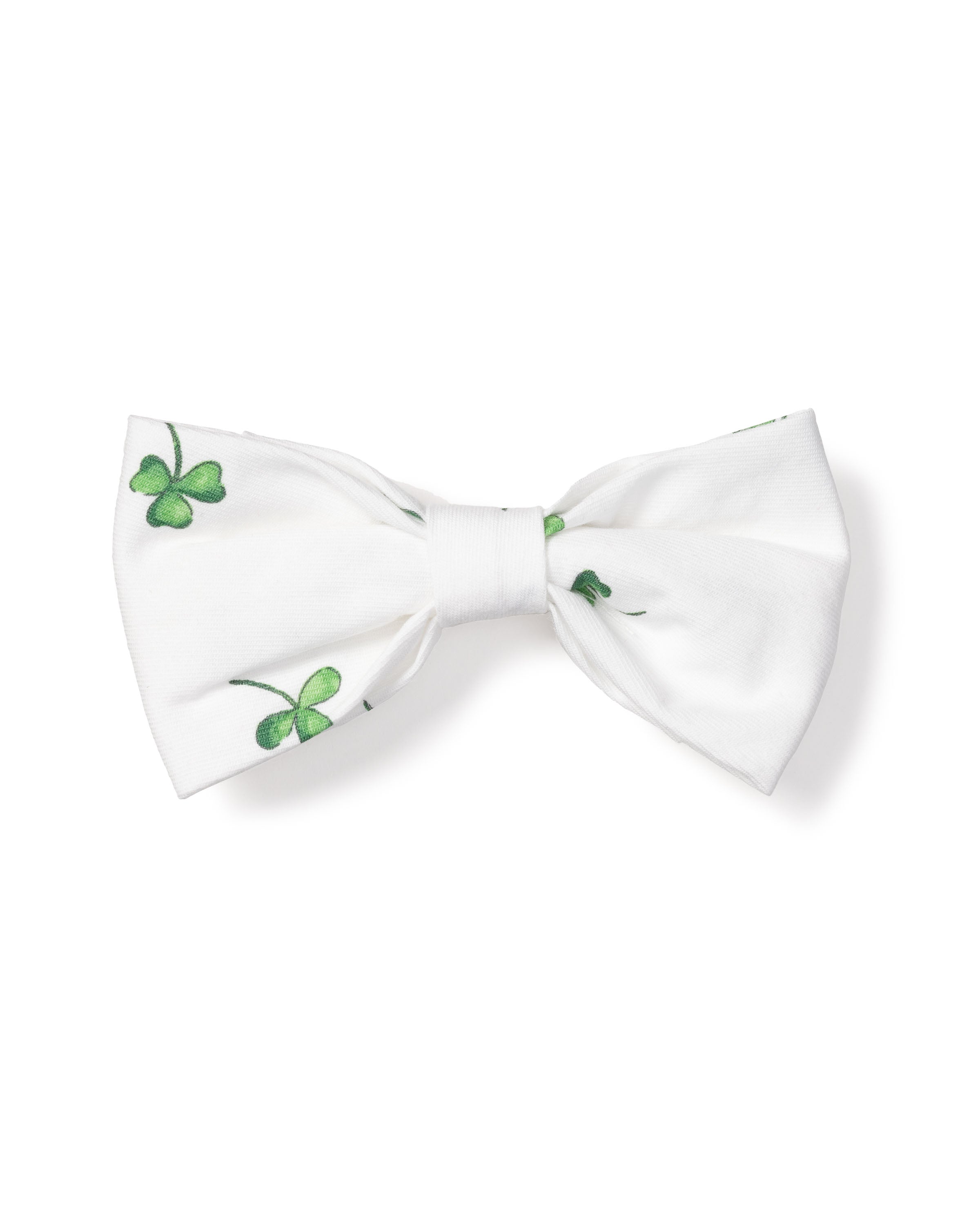 The Dog Twill Bow Tie in Shamrocks by Petite Plume features small green shamrocks on a crisp white background, perfect for adding holiday flair to your pets wardrobe.