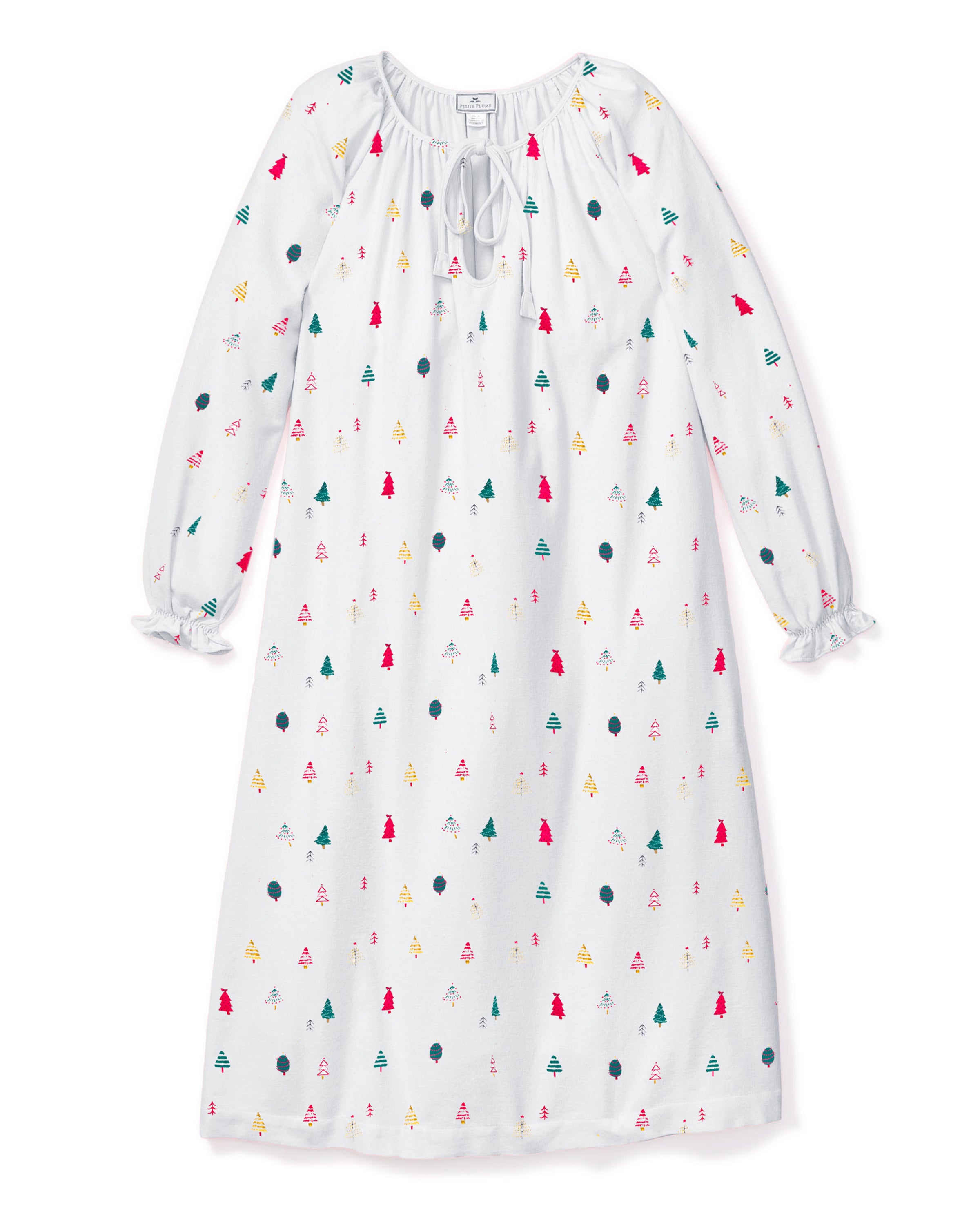 The Womens Twill Delphine Nightgown in Merry Trees by Petite Plume is a white cotton sleepwear piece with long sleeves, featuring colorful Christmas trees and polka dots. It has a round neckline with a tie and charming ruffled sleeve cuffs.