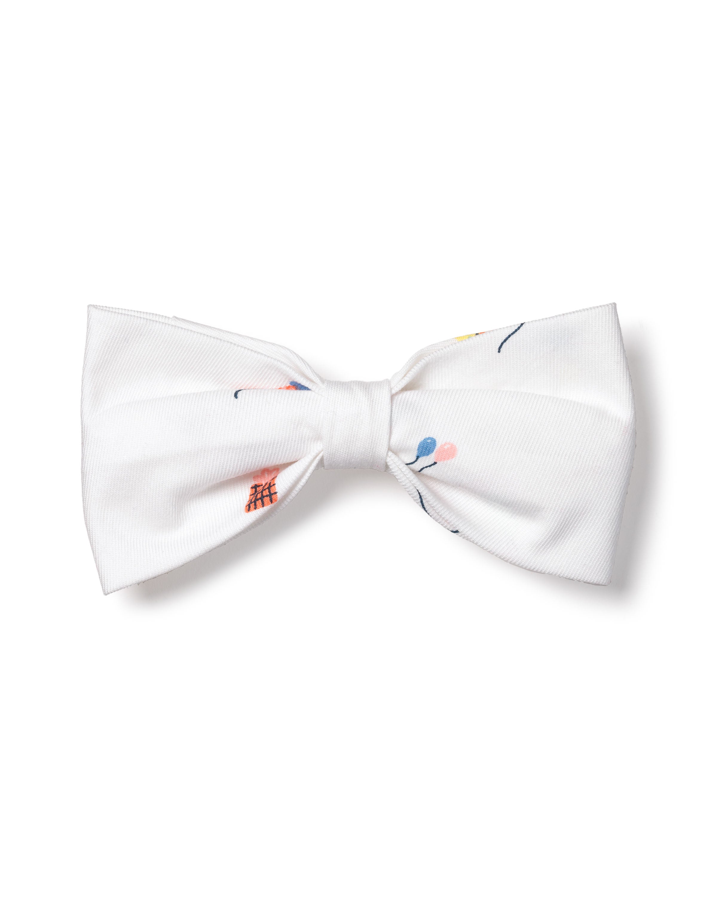 A white dog bowtie from Petite Plume, named Dog Twill Bow Tie in Birthday Wishes, with a subtle floral pattern featuring small pink, blue, and orange flowers is perfect for adding a touch of holiday pet fashion.