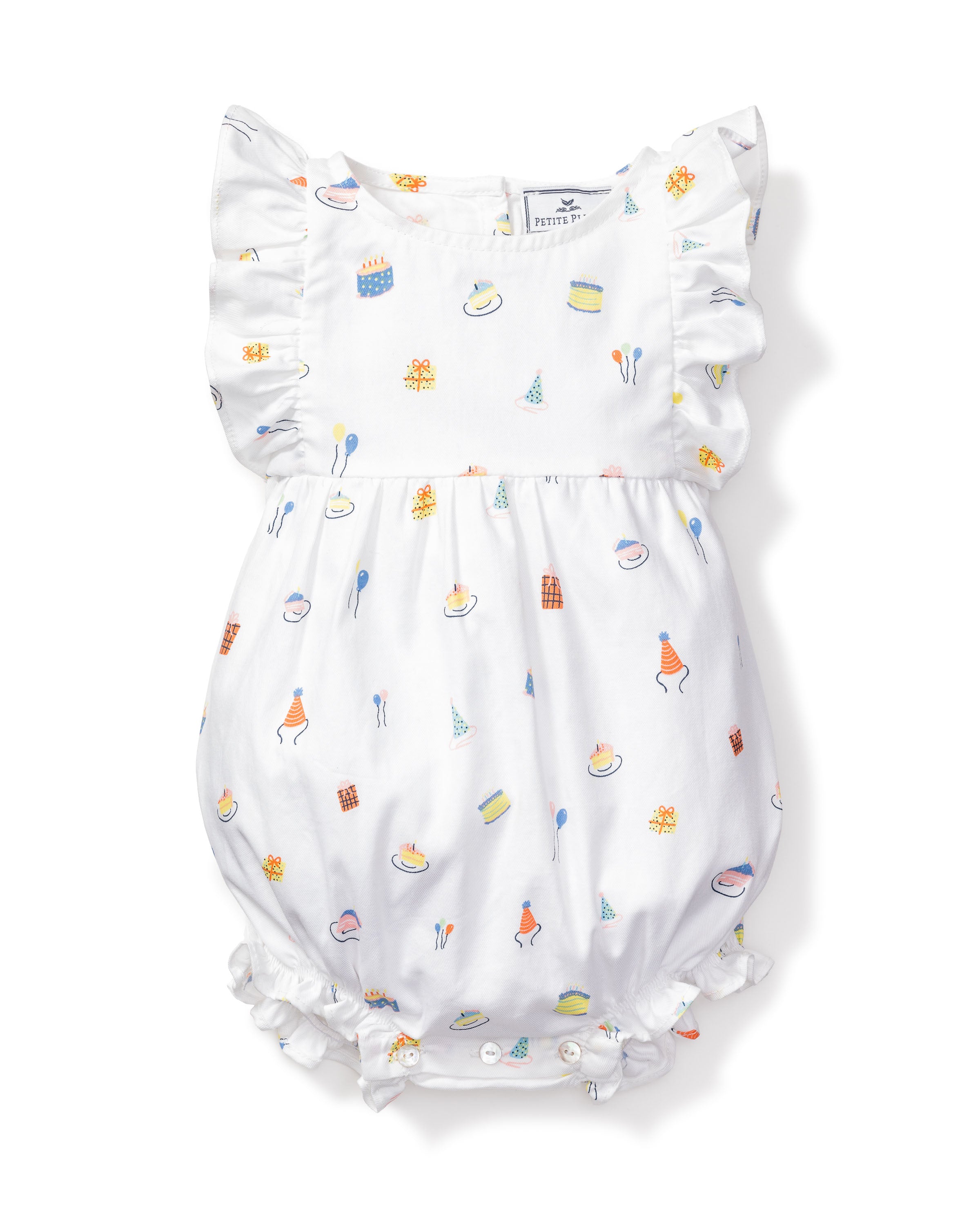 Petite Plume’s Babys Twill Ruffled Romper in Birthday Wishes is a white romper made from soft yarn-dyed cotton. It features ruffled sleeves, colorful cake and dessert illustrations, and has elastic hems for a snug fit, making it perfect for sleepwear.