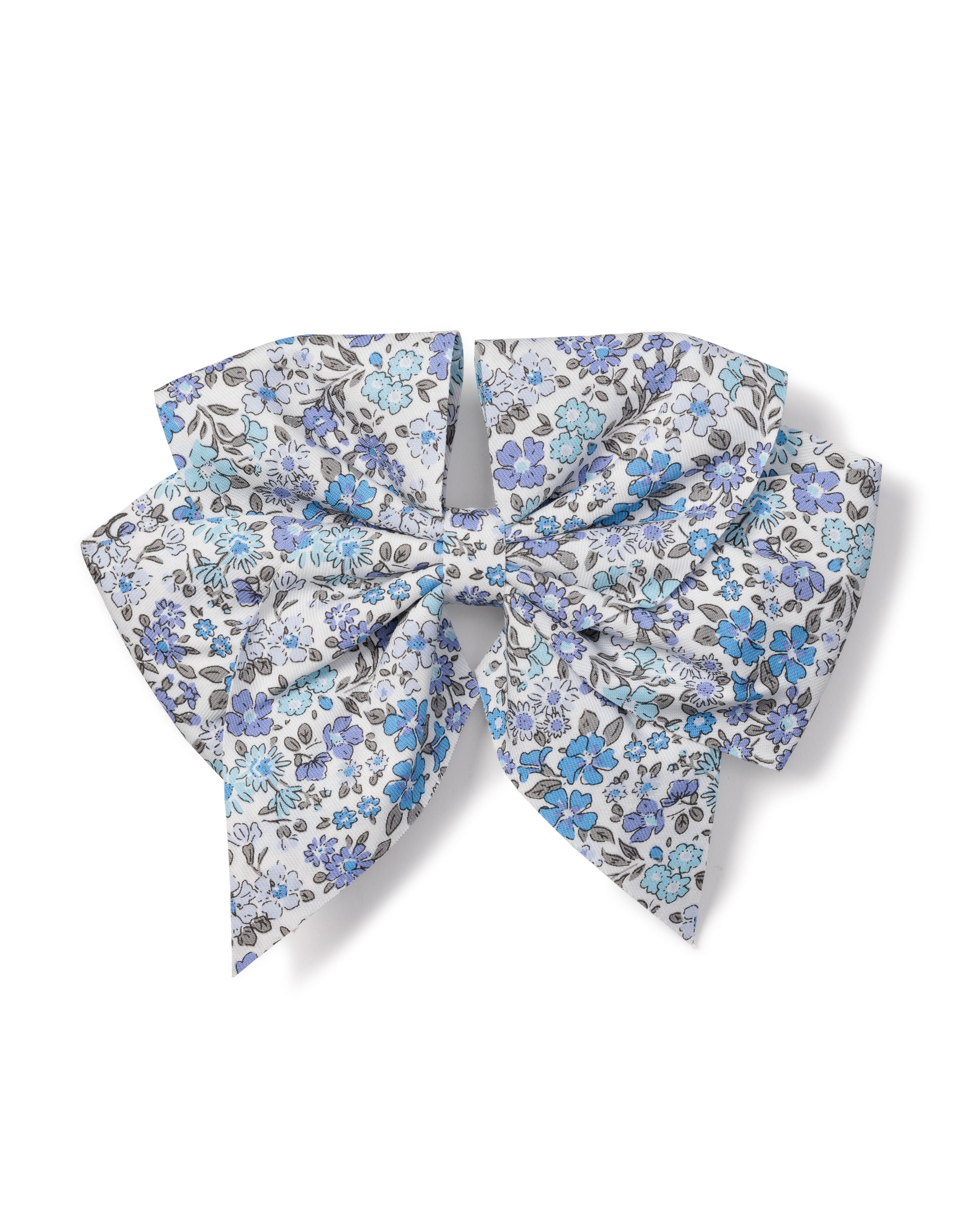 The Petite Plume Girls Twill Hair Bow in Fleur DAzur is a charming accessory with two loops and four hanging ends, symmetrically arranged, featuring a floral pattern in enchanting blue, light blue, and gray shades against a white background—ideal for girls hair.