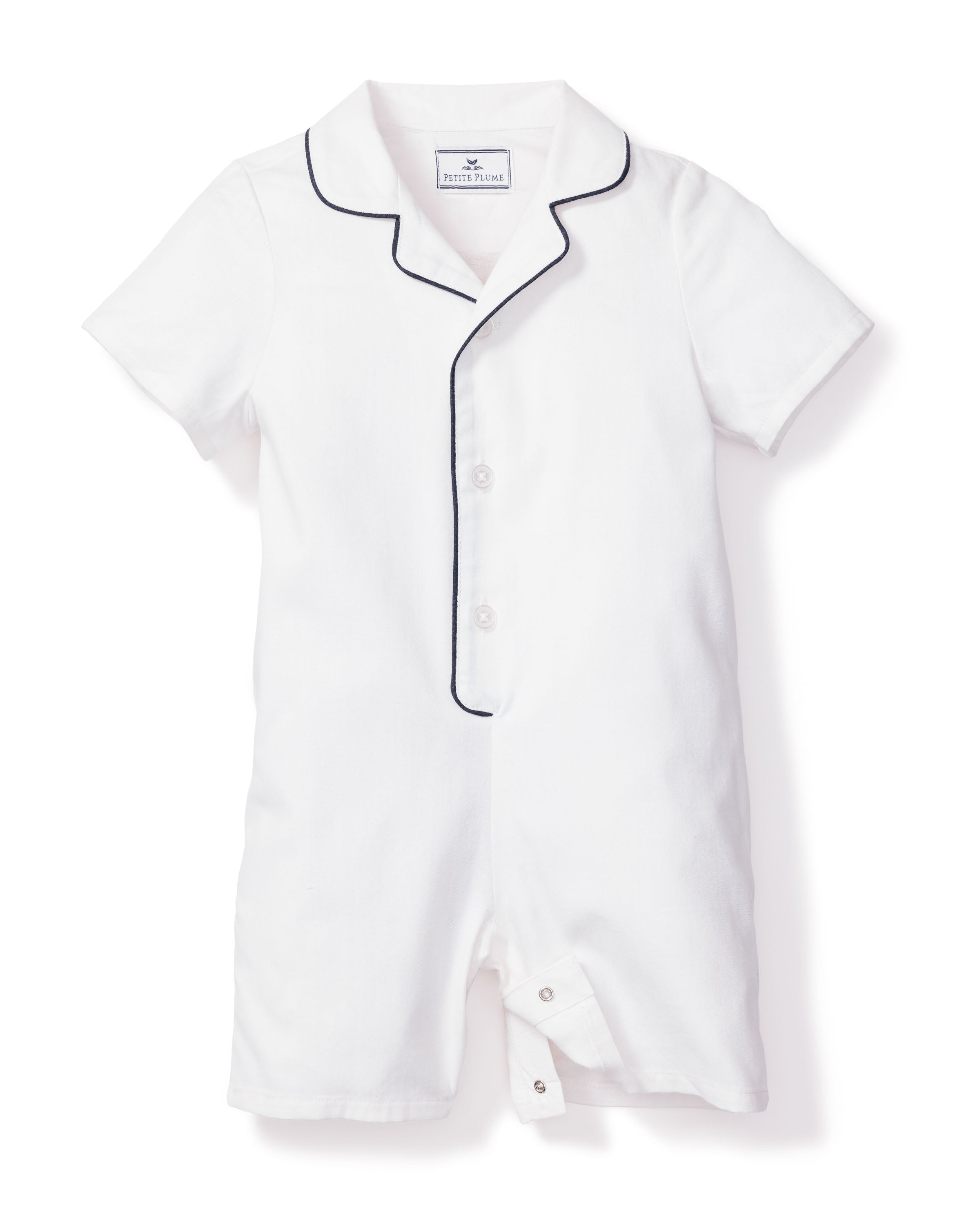 Petite Plumes Babys Twill Summer Romper features a luxurious yarn-dyed cotton design with short sleeves and navy piping on the collar. This classic white romper includes center buttons and a bottom closure for easy changes.