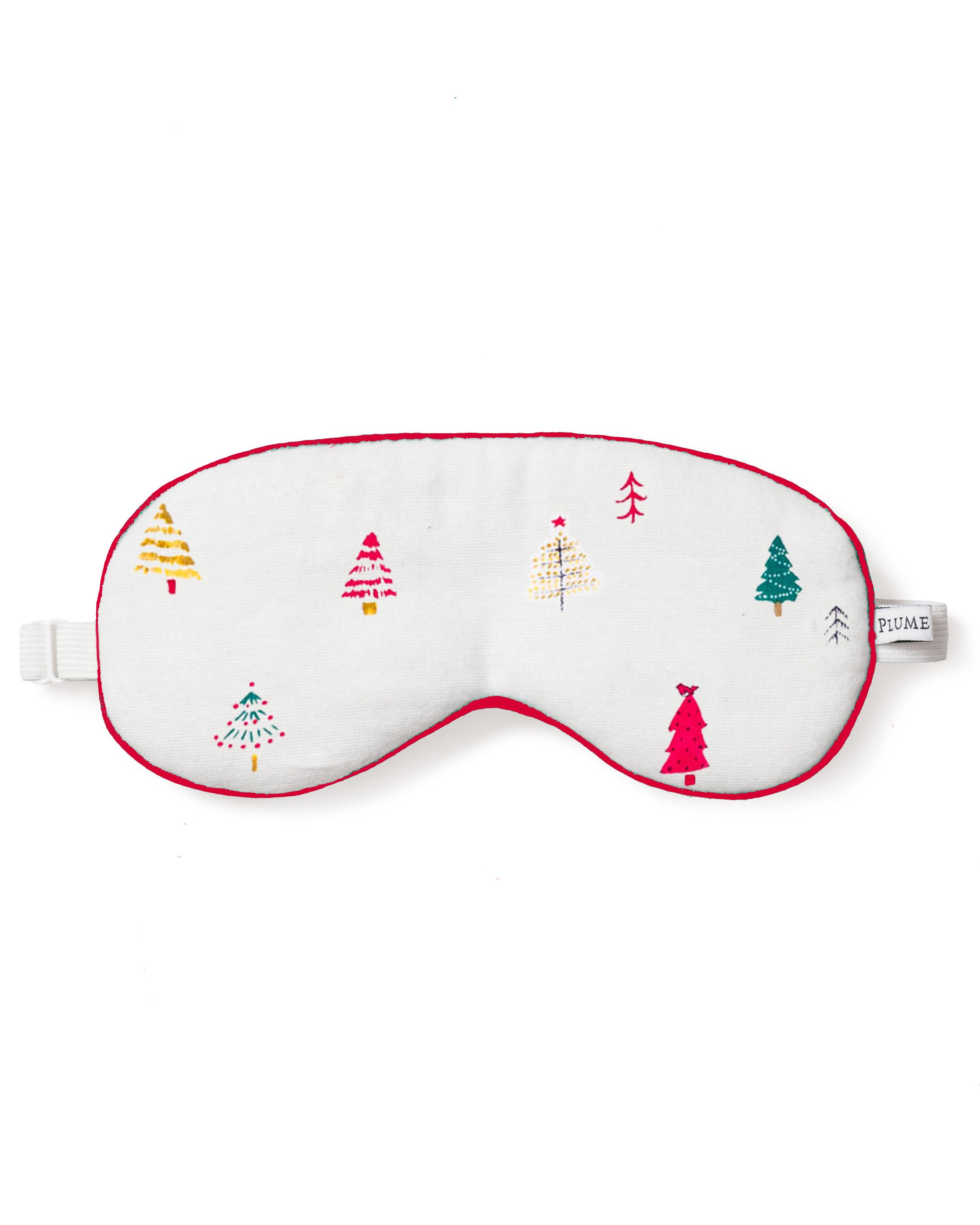 The Adults Sleep Mask in Merry Trees by Petite Plume features a white exterior with red lining and colorful embroidered trees. Its perfect for sleepovers, thanks to its adjustable strap and small side tag, making it an ideal choice for those seeking matching masks for group events.