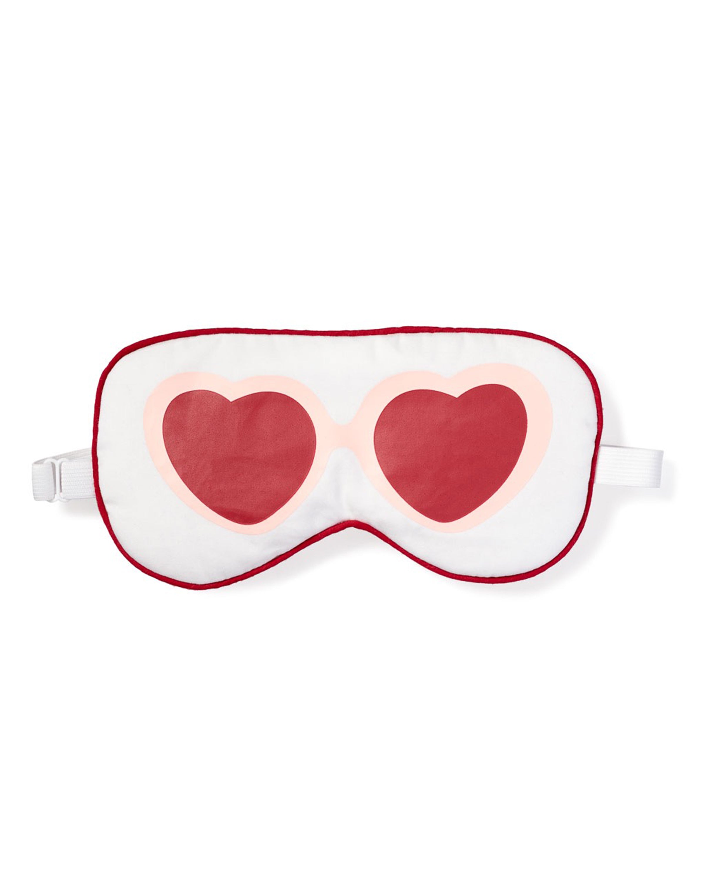 The Adults Maisonette Exclusive Je tadore Valentines Sleep Mask by Petite Plume features chic pink sunglasses with red heart lenses on a white background with a red border. It offers comfort with an adjustable white elastic strap and is ideal for pairing with matching eye masks. Perfect as a gift.