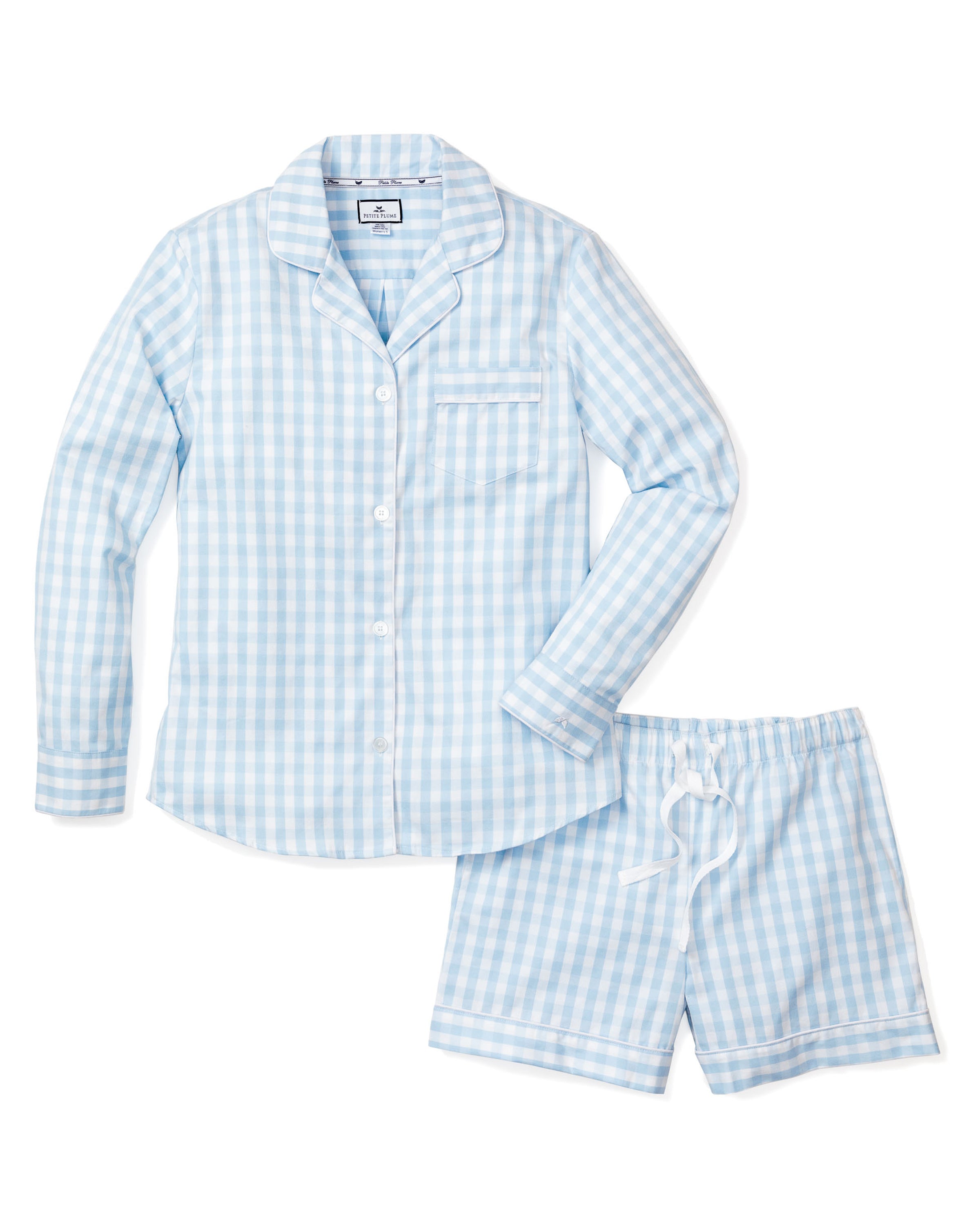 The Womens Twill Pajama Long Sleeve Short Set in Light Blue Gingham by Petite Plume features a button-up shirt with chest pocket and drawstring shorts, all crafted from cozy cotton twill, displayed on a plain white background.