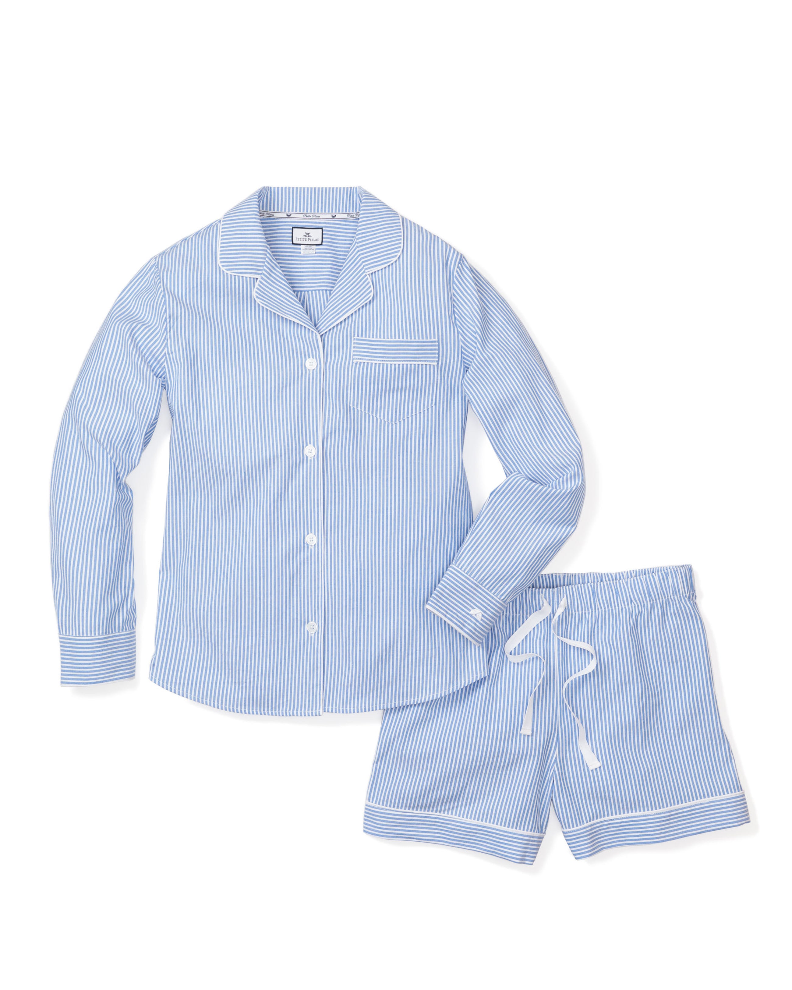 The Womens Twill Long Sleeve Short Set by Petite Plume in French Blue Seersucker features a blue and white striped 100% cotton pajama set with a button-up shirt, front pocket, and shorts with a white drawstring, offering lightweight comfort for restful nights.