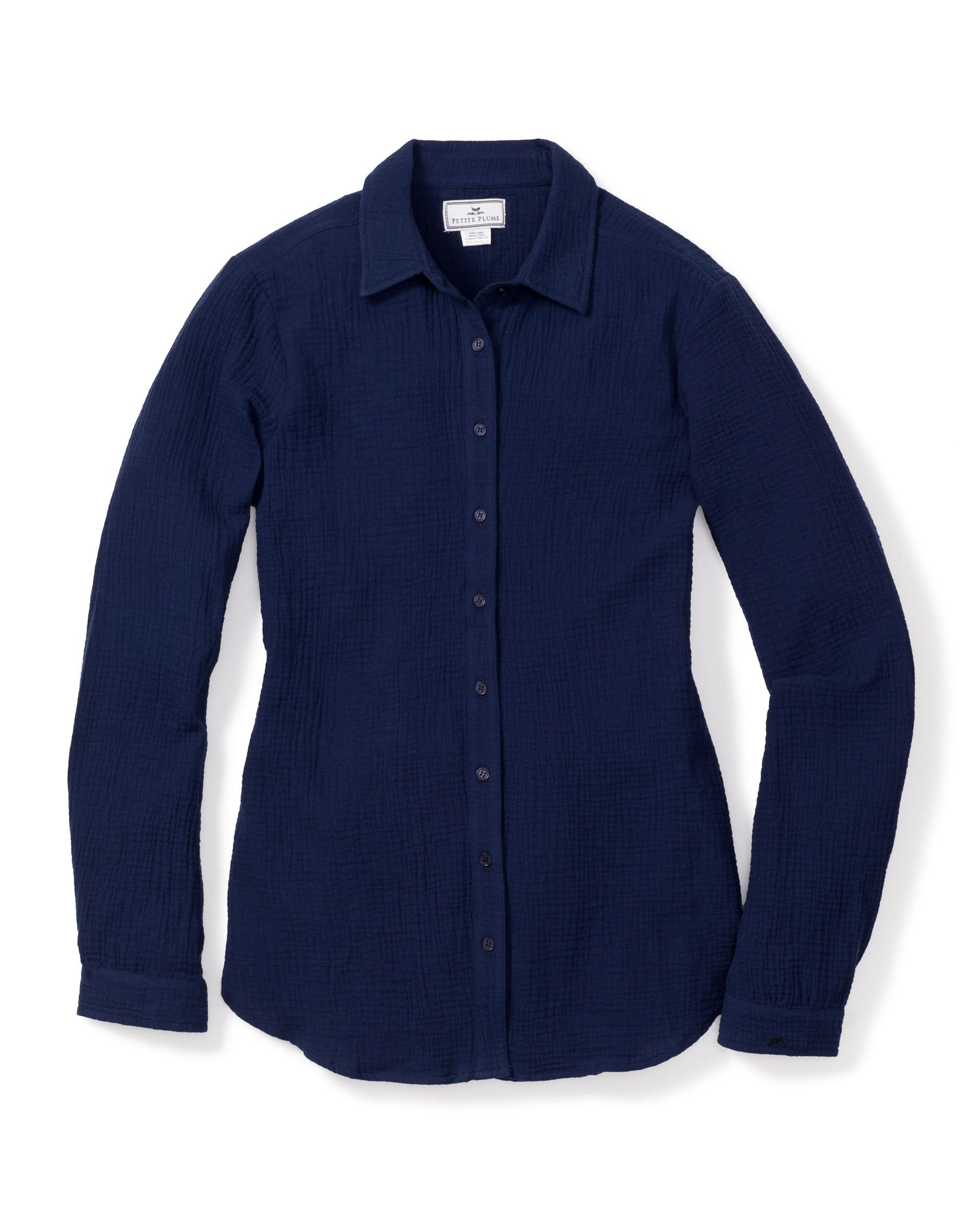The Womens Gauze Morgan Top in Navy by Petite Plume is a cotton gauze, long-sleeved button-up with a textured finish and classic collar. Part of the luxury Gauze Collection, its elegantly displayed flat on a white background.