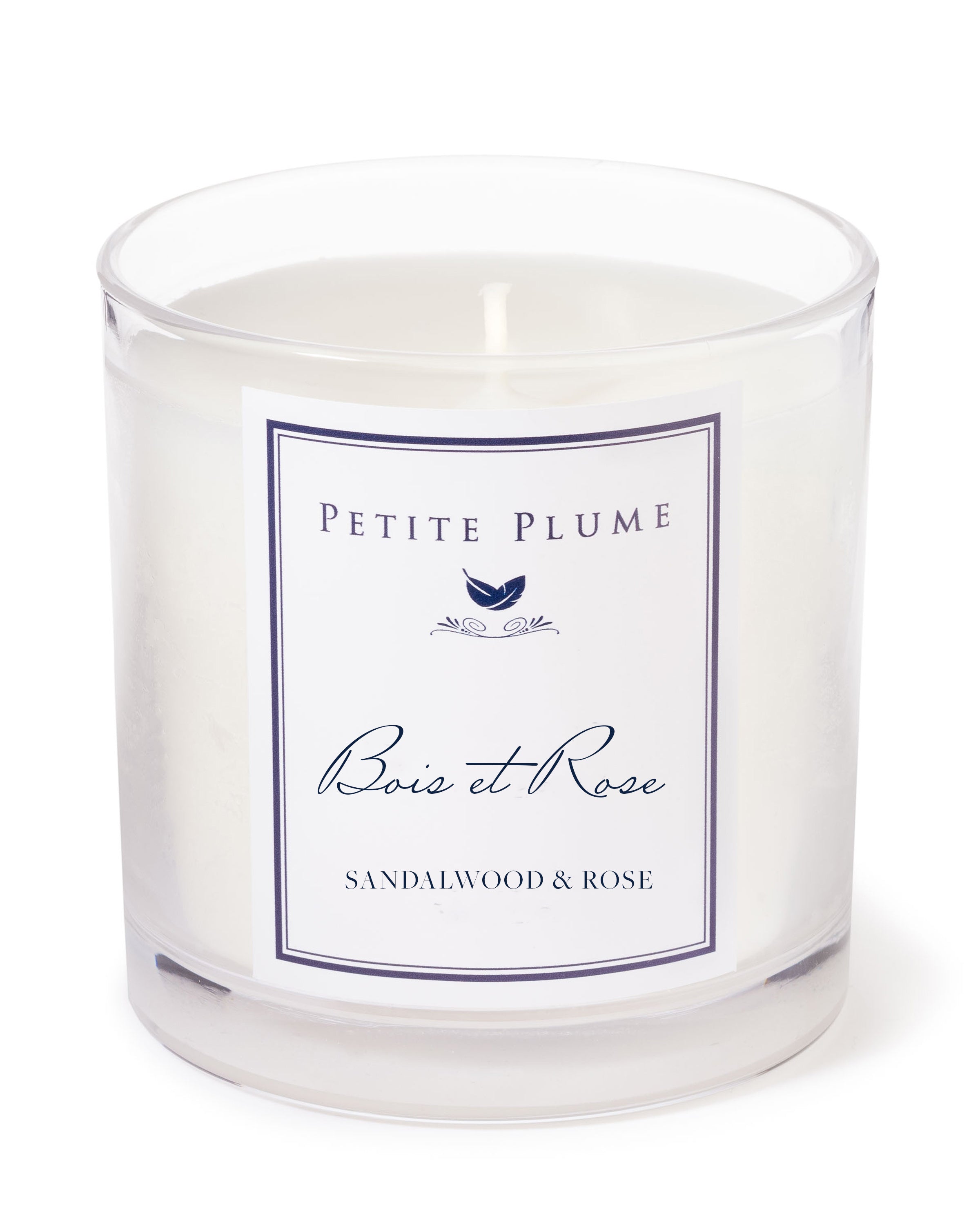 From the exclusive Candle Collection, the Petite Plume Bois et Rose candle by Petite Plume features an enchanting Sandalwood & Rose scent. Its white wax and single wick complement a chic navy blue bird design on the label.
