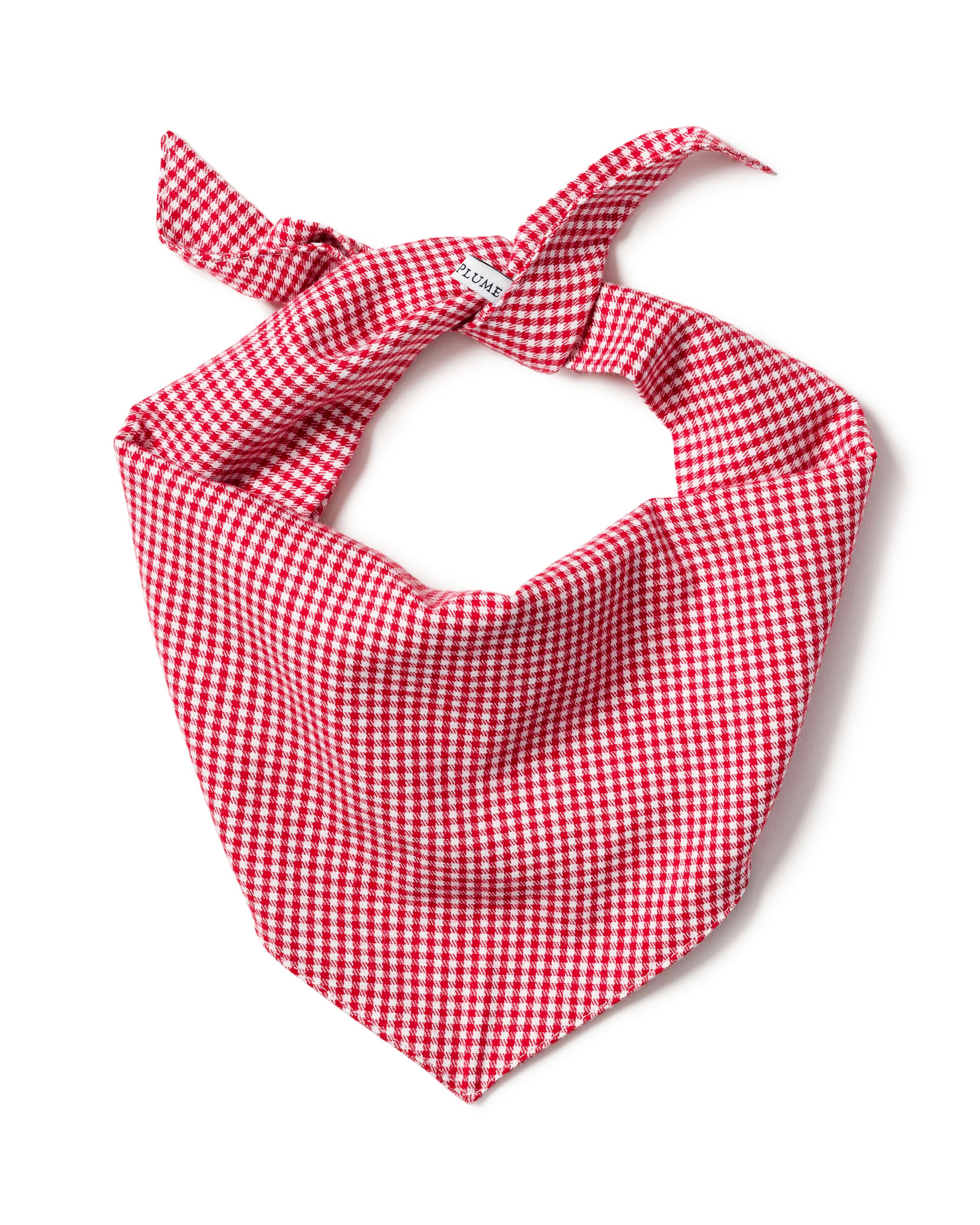 The Petite Plume Dog Bandana in Red Mini Gingham is a charming triangular bandana with two tied ends at the top, making it the perfect stylish accessory for any fashionable pup.