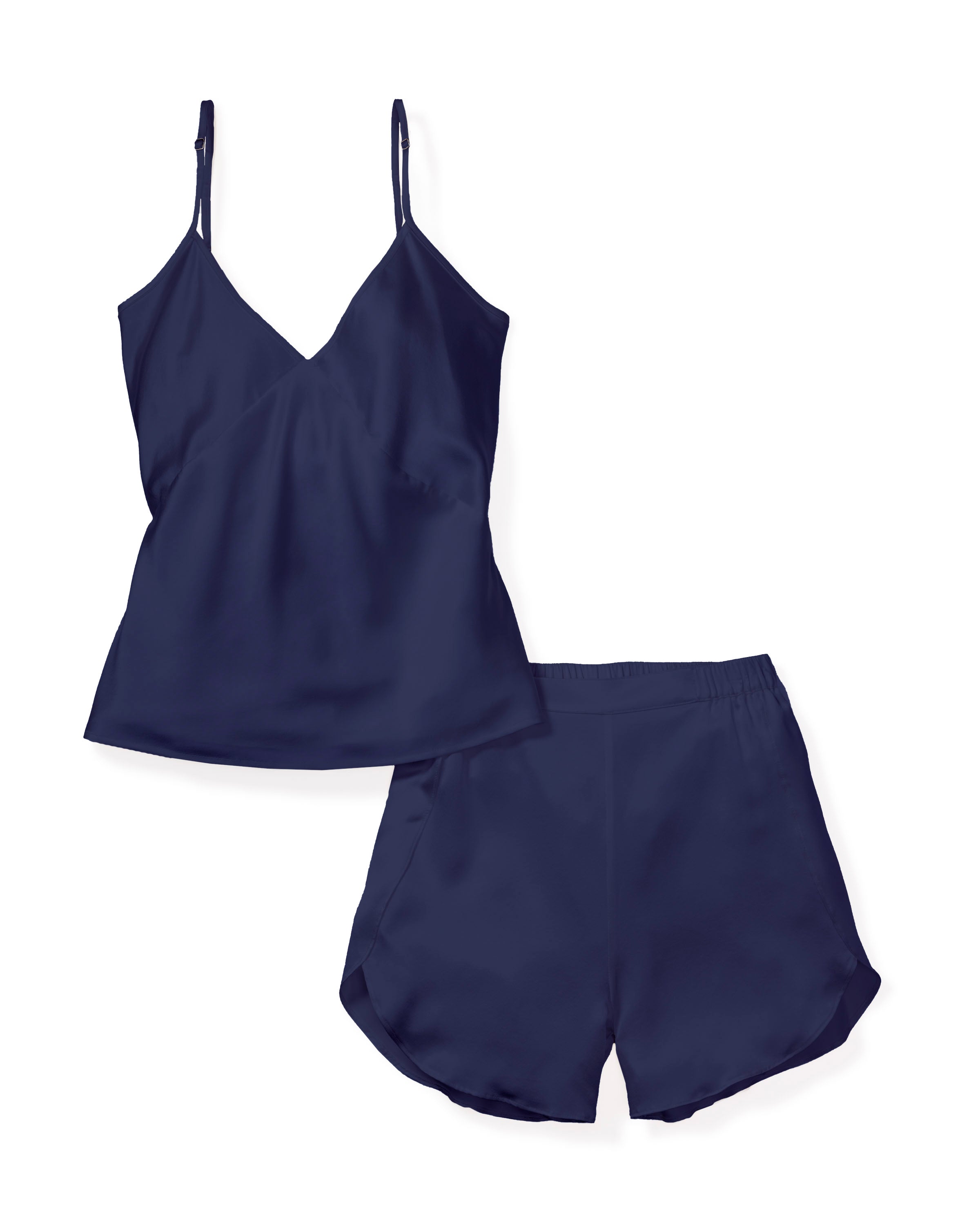 Experience opulent comfort with the Womens Silk Cami Short Set in Navy by Petite Plume. This hypoallergenic sleepwear features a smooth, shiny texture with a sleeveless V-neck top and matching shorts, ensuring a relaxed fit perfect for luxurious nights.