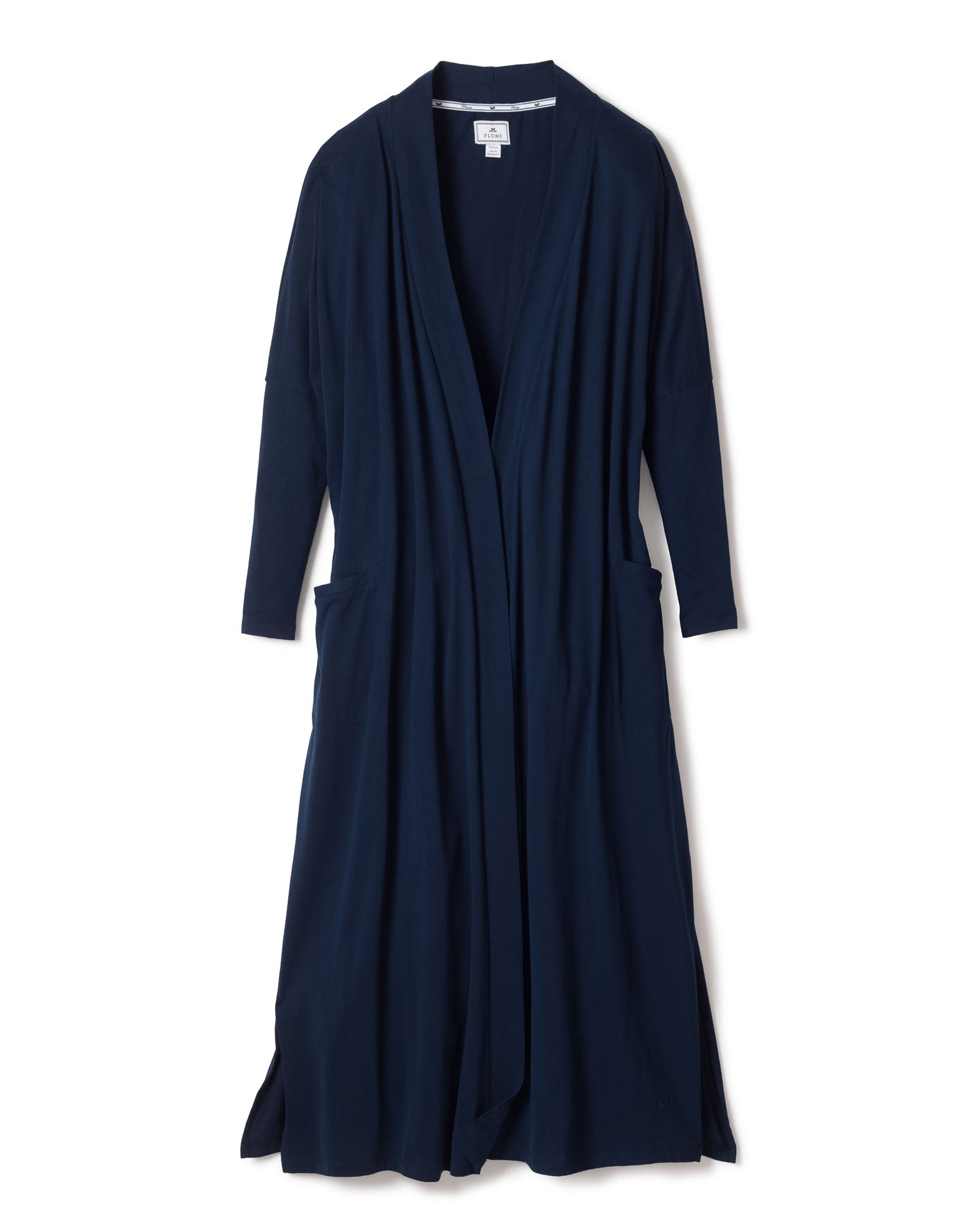 The Womens Pima Duster in Navy by Petite Plume is a luxurious, dark blue cardigan made from breathable Peruvian Pima cotton. It has an open front, long sleeves, and side pockets, elegantly displayed against a plain white background.