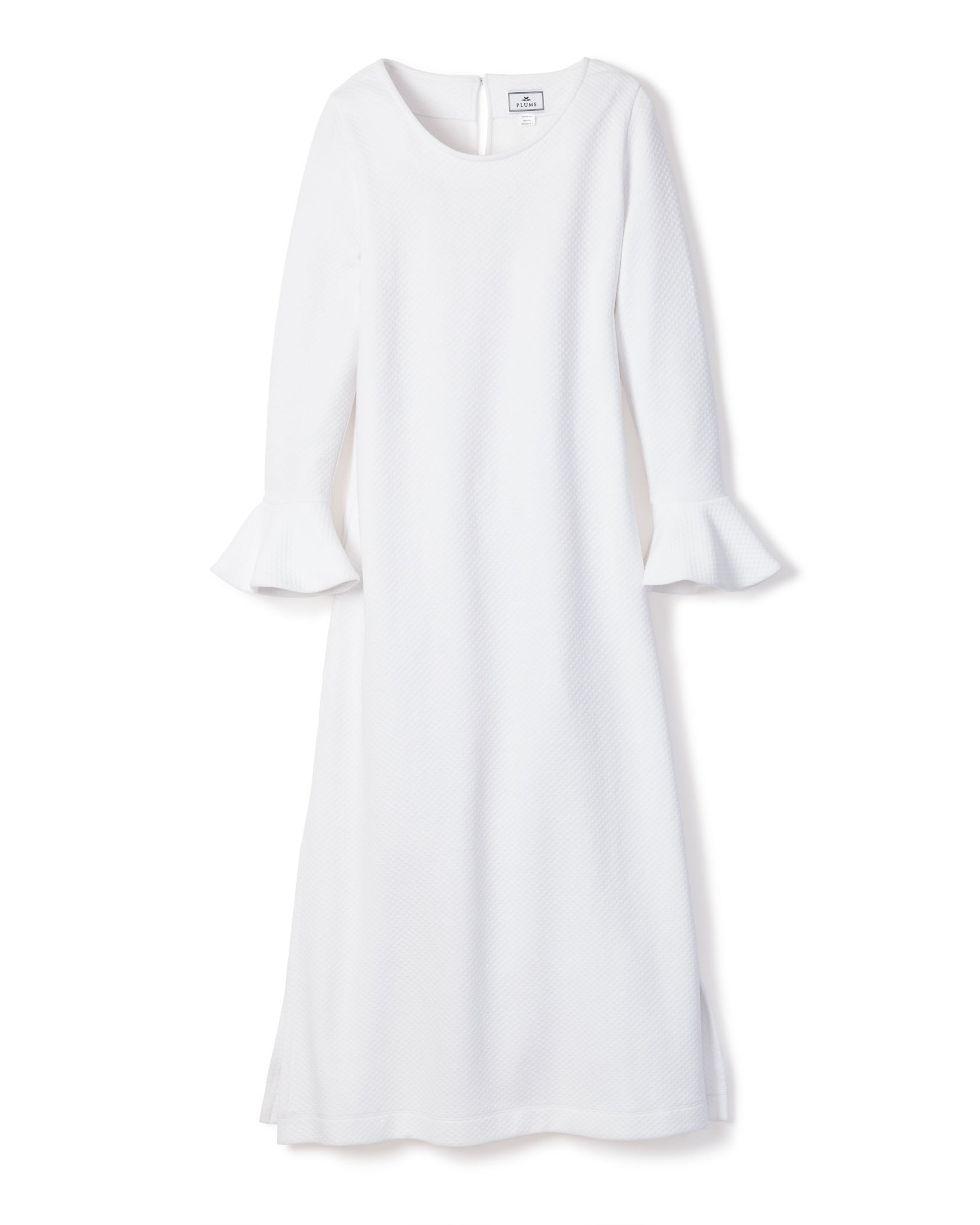 The Womens Pima Ophelia Nightgown by Petite Plume features flared cuffs, a round neckline, and a straight silhouette at midi length. Crafted from luxurious Peruvian Pima cotton, it showcases a subtle quilted effect in white jacquard against a plain white background.
