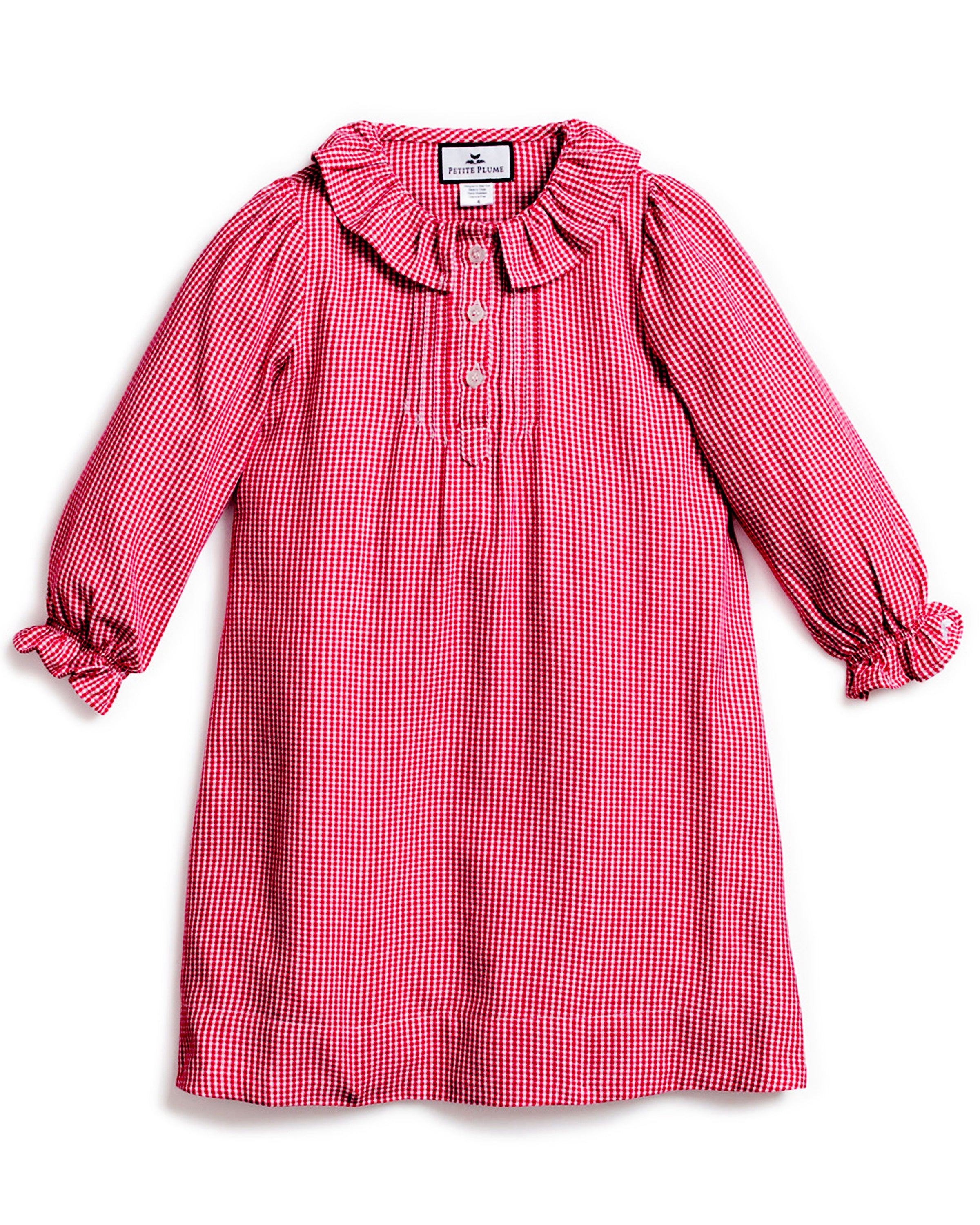 The Girls Flannel Victoria Nightgown by Petite Plume in red mini gingham features long sleeves, a ruffled collar and cuffs, front button detailing, and a comfortable loose fit, making it perfect for any occasion.