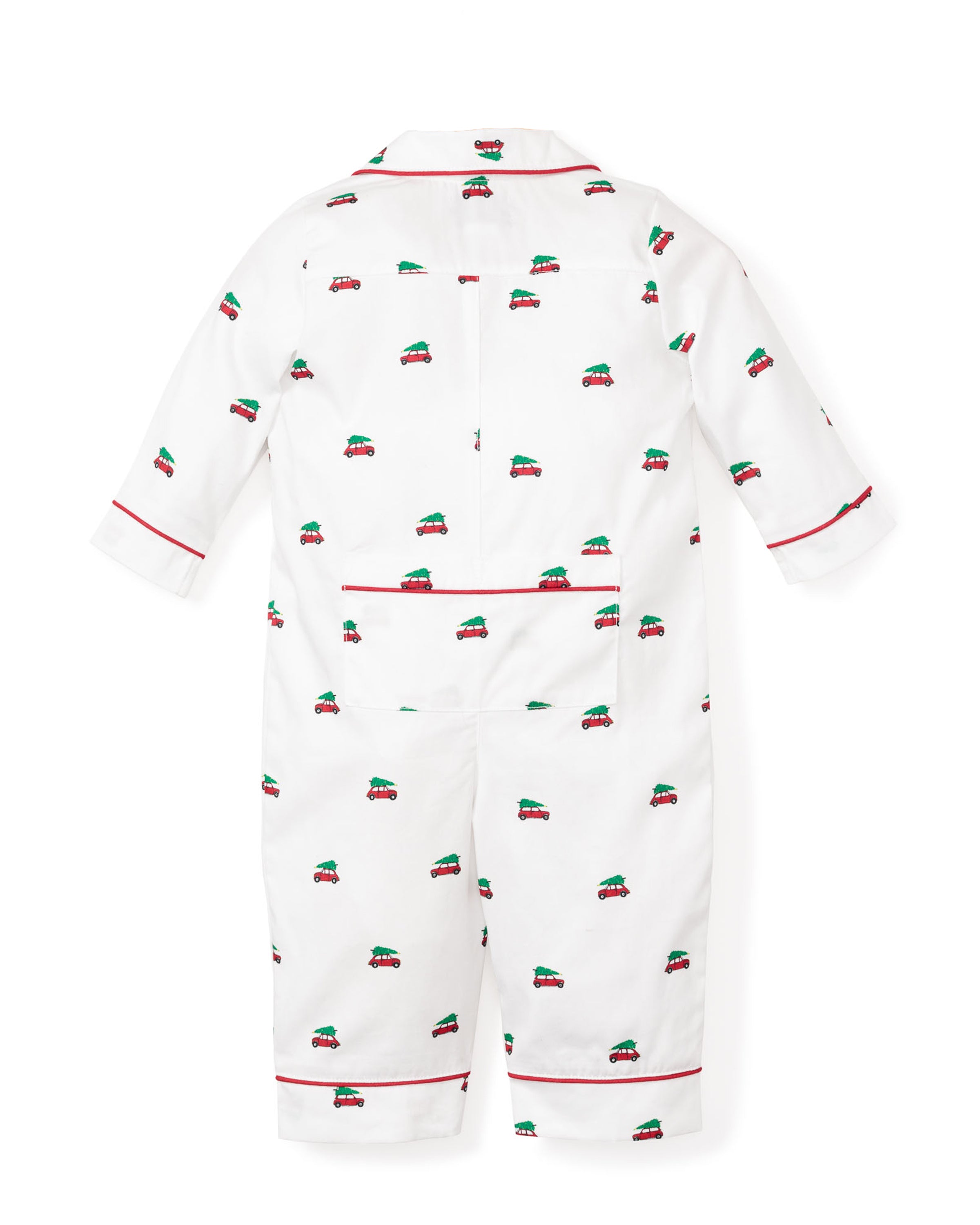 Petite Plumes Babys Twill Romper in Holiday Journey features small red and green car patterns on white brushed fabric, luxurious red piping on cuffs and collar, with long sleeves and full-length pants, shown laid flat against a white background.