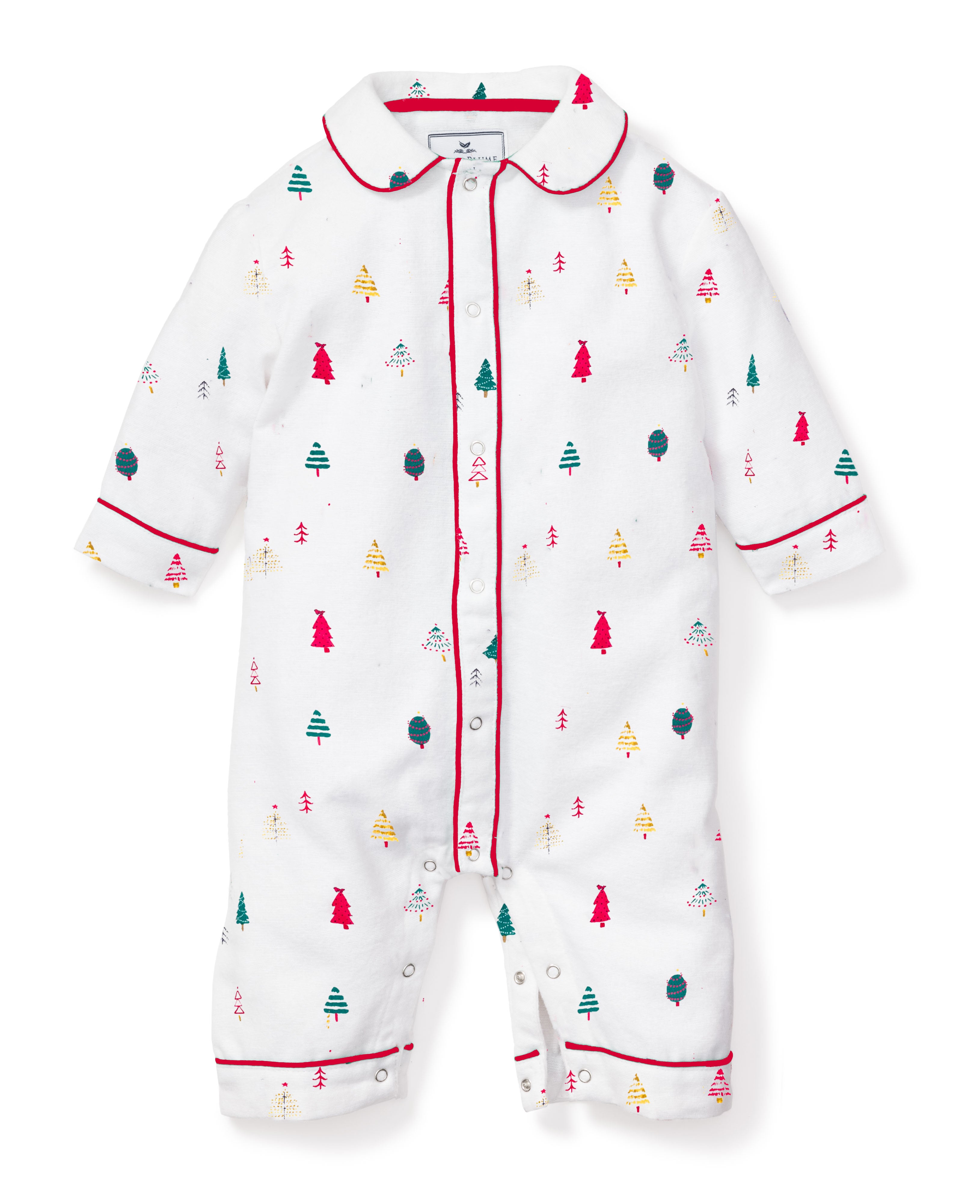 The Babys Twill Cambridge Romper in Merry Trees by Petite Plume showcases a festive pattern of colorful Christmas trees and is crafted from brushed fabric, featuring red piping along the collar, cuffs, and front buttons for added charm.